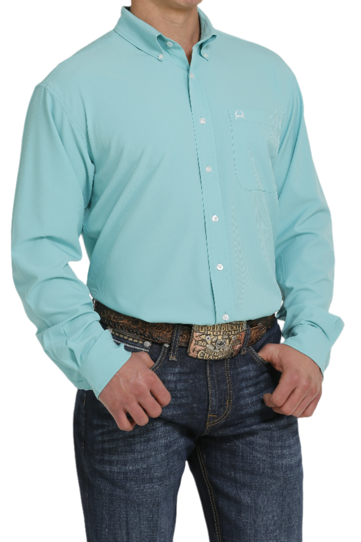 A man wearing a long-sleeve turquoise button-down shirt and blue jeans. The shirt has a single chest pocket and white buttons.