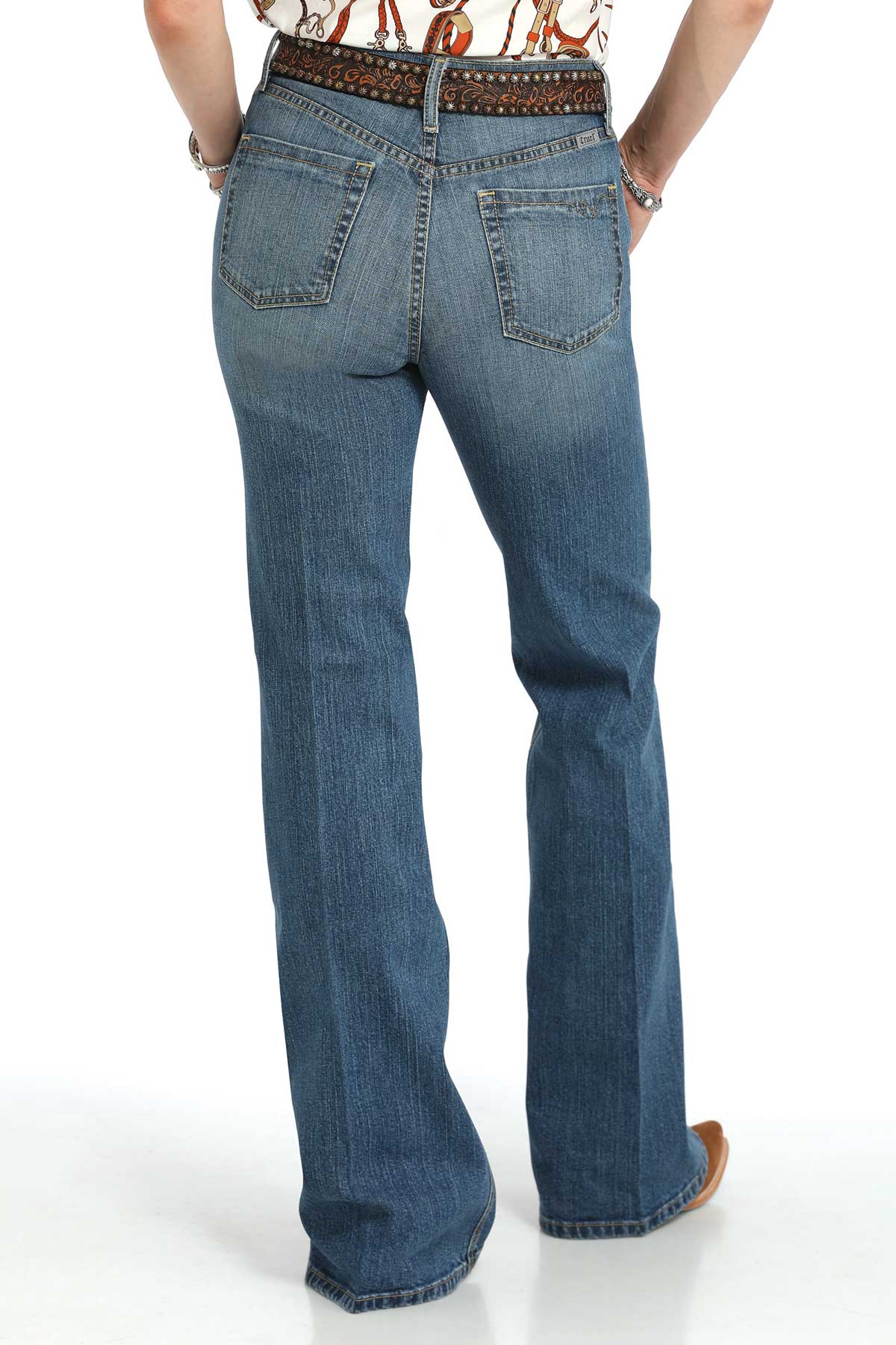 Blue jeans worn by a person on a white background