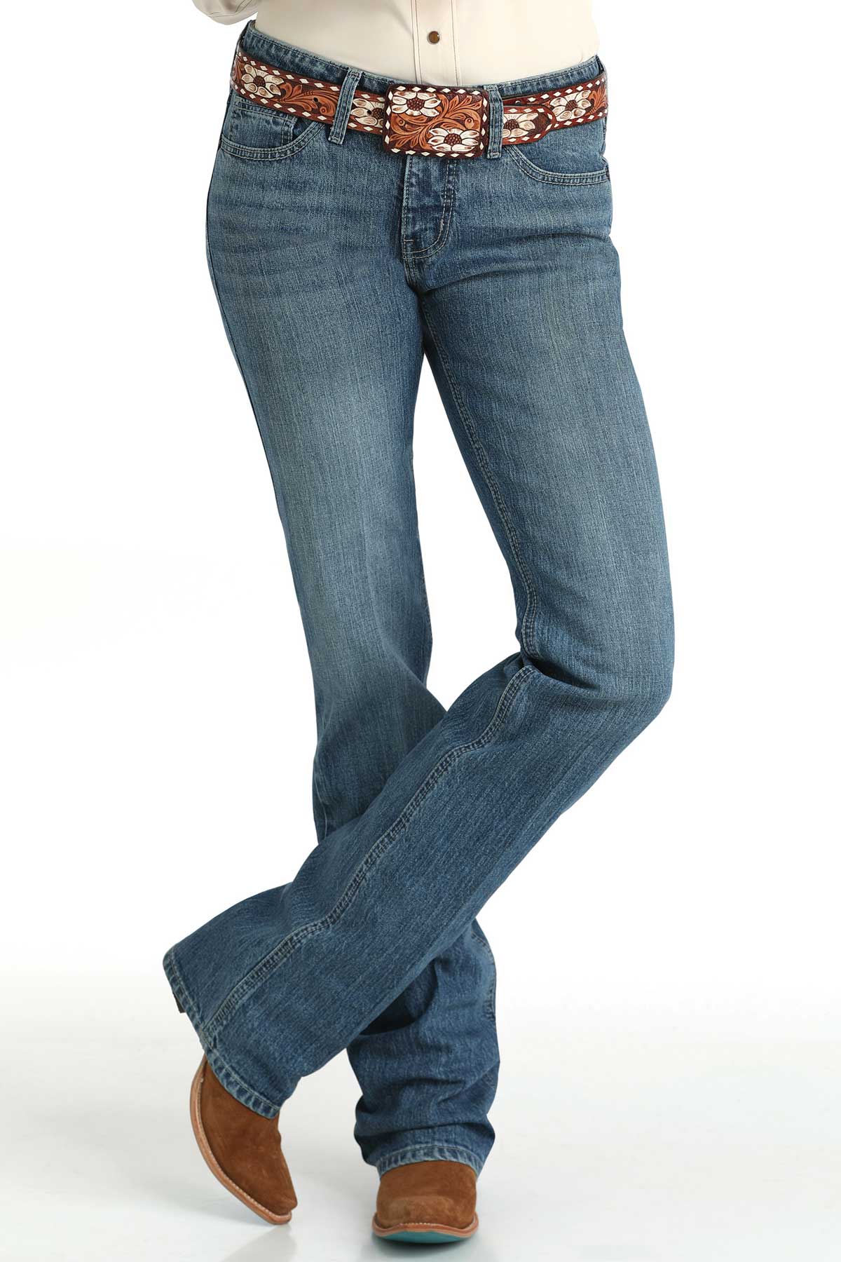 Blue jeans with a patterned belt on a white background