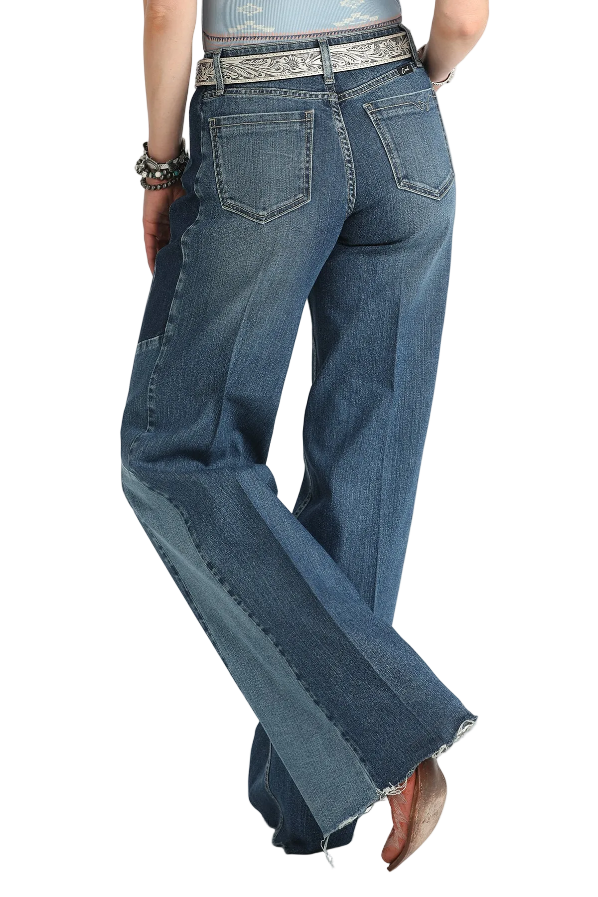 Blue jeans worn by a person on a white background
