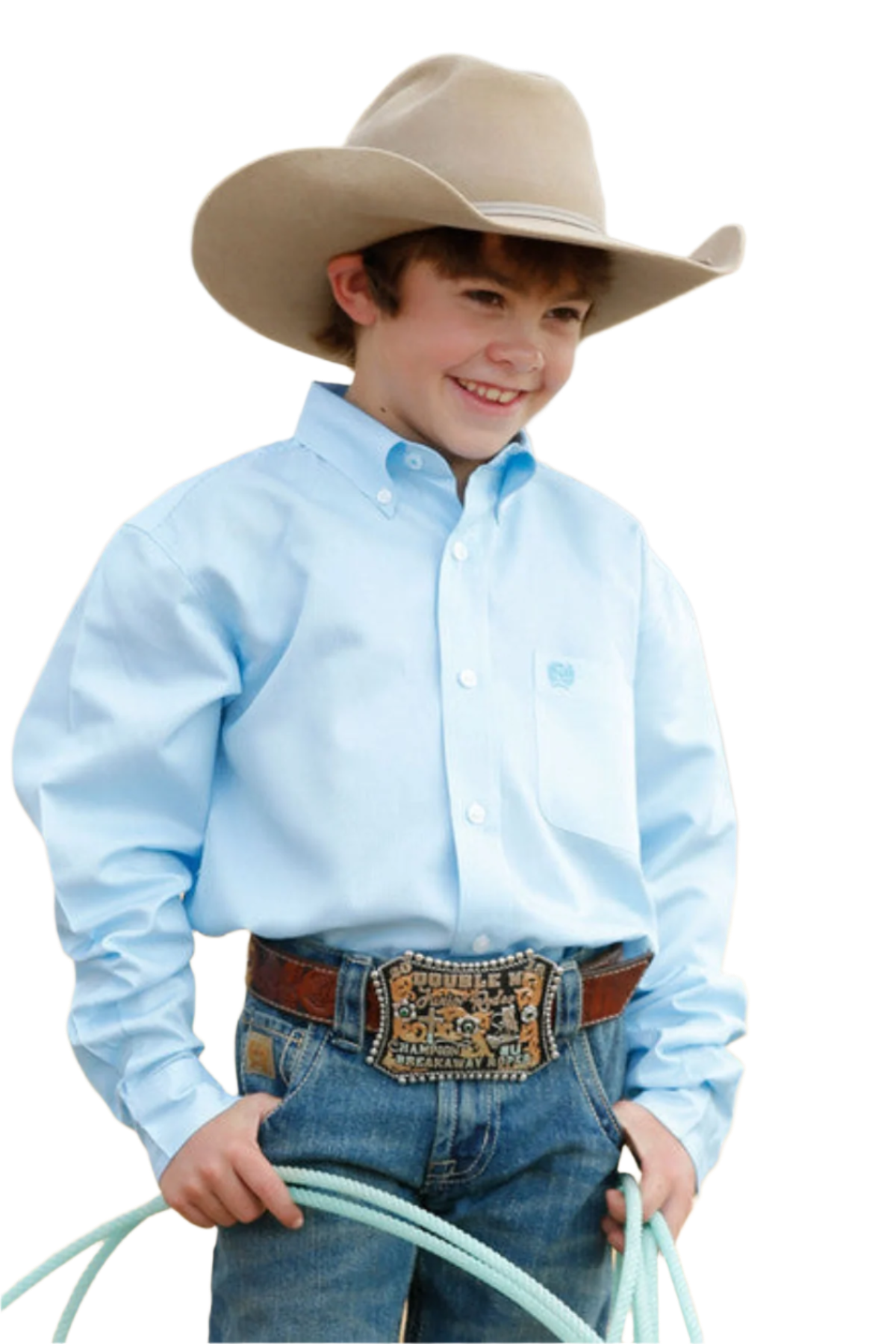 Boy wearing a light blue long sleeve button down shirt with jeans, a cowboy hat, and a belt, holding a rope.