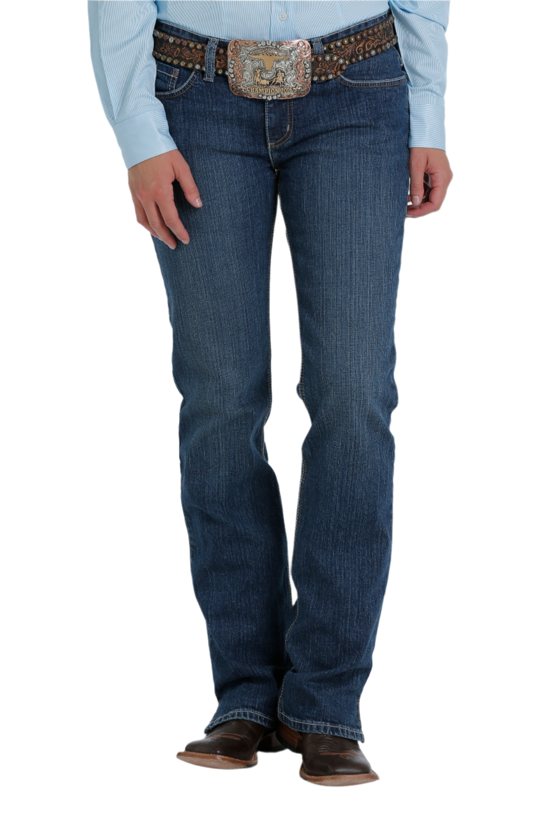 Woman wearing blue jeans with boots and a belt