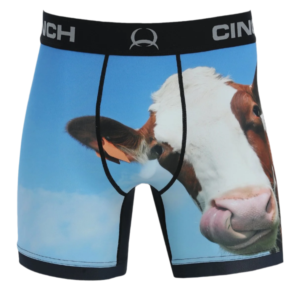 A pair of Cinch men's boxer briefs with a humorous cow design on the front.