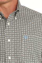 Close-up of cream graphic print long sleeve Cinch shirt with button-down collar and embroidered logo on chest pocket