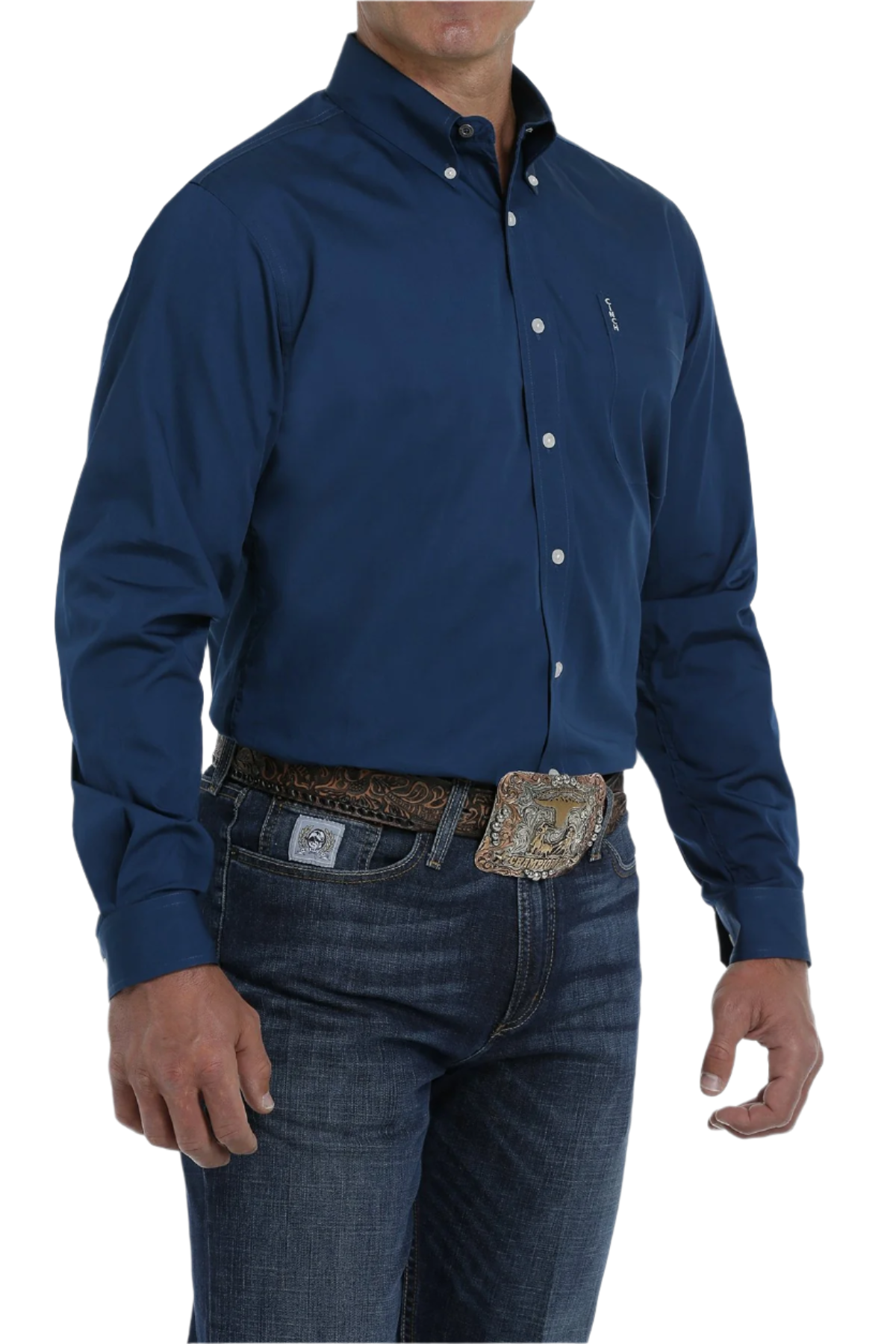 A man wearing a long-sleeve blue button-down shirt and blue jeans. The shirt has a single chest pocket and white buttons.