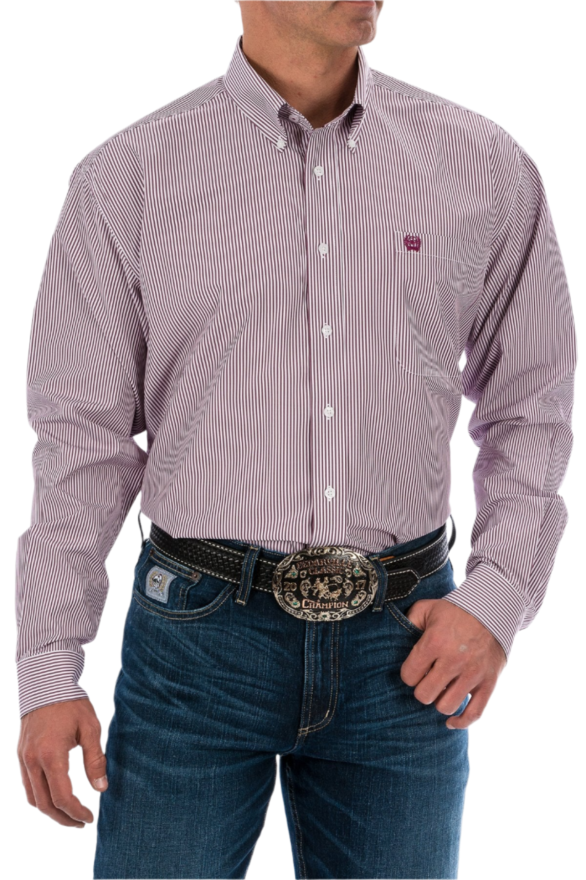 A man wearing a long sleeve striped button-down shirt in burgundy with jeans and a western belt