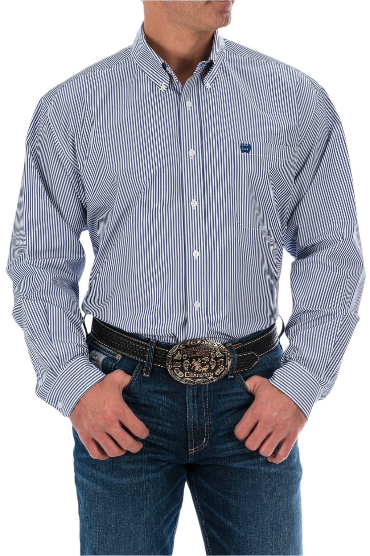A man wearing a long sleeve striped button-down shirt in blue and white with jeans and a western belt