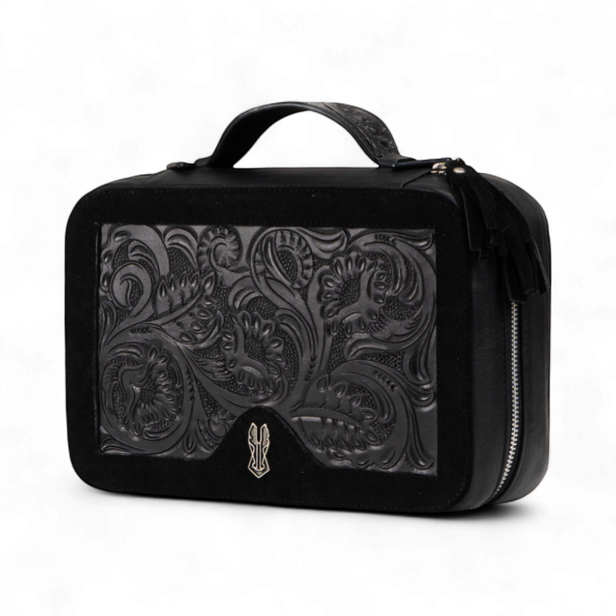 Black leather travel case with intricate paisley pattern on a white background