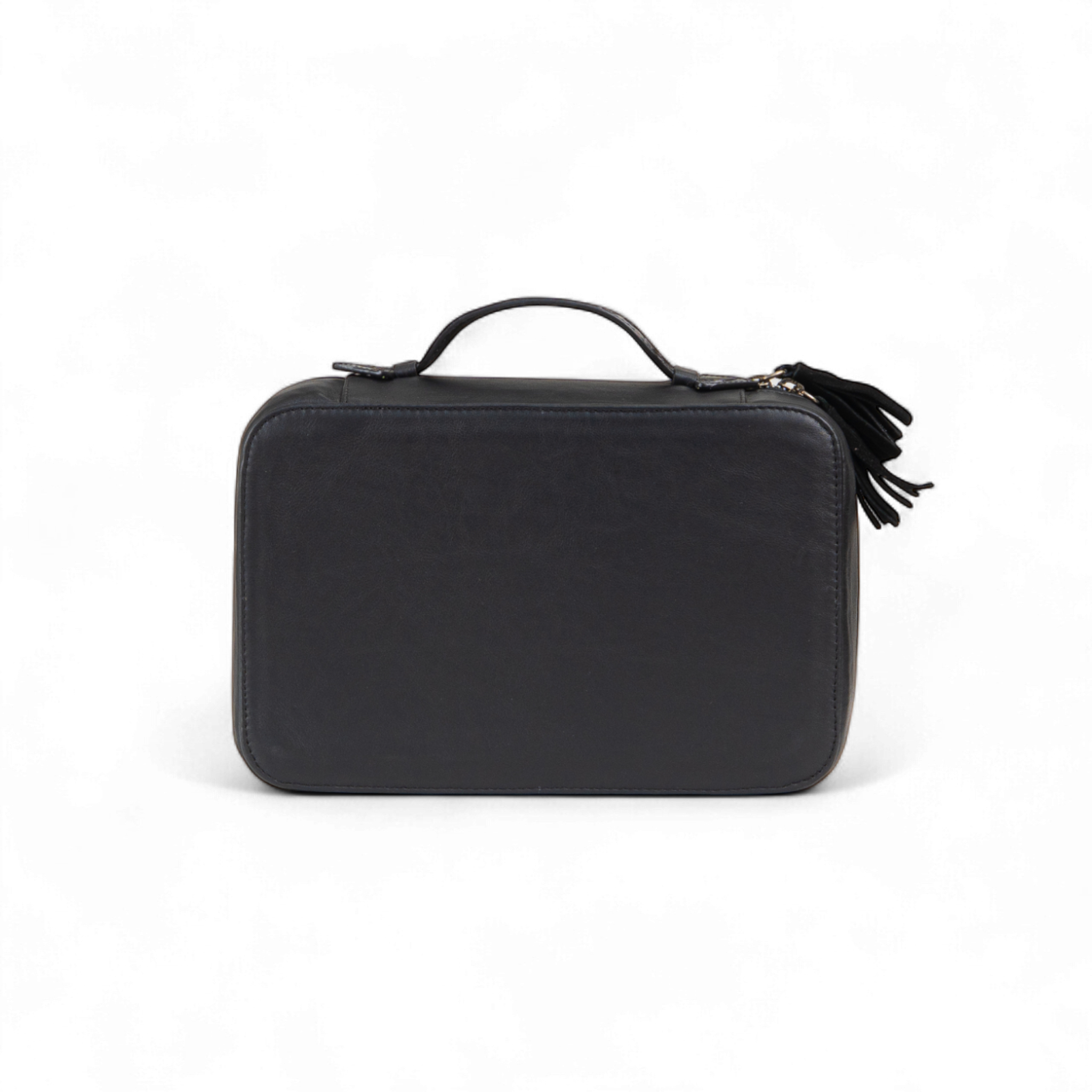 Black rectangular toiletry bag with a smooth exterior and a small handle on top, featuring a zipper closure with decorative tassel pulls