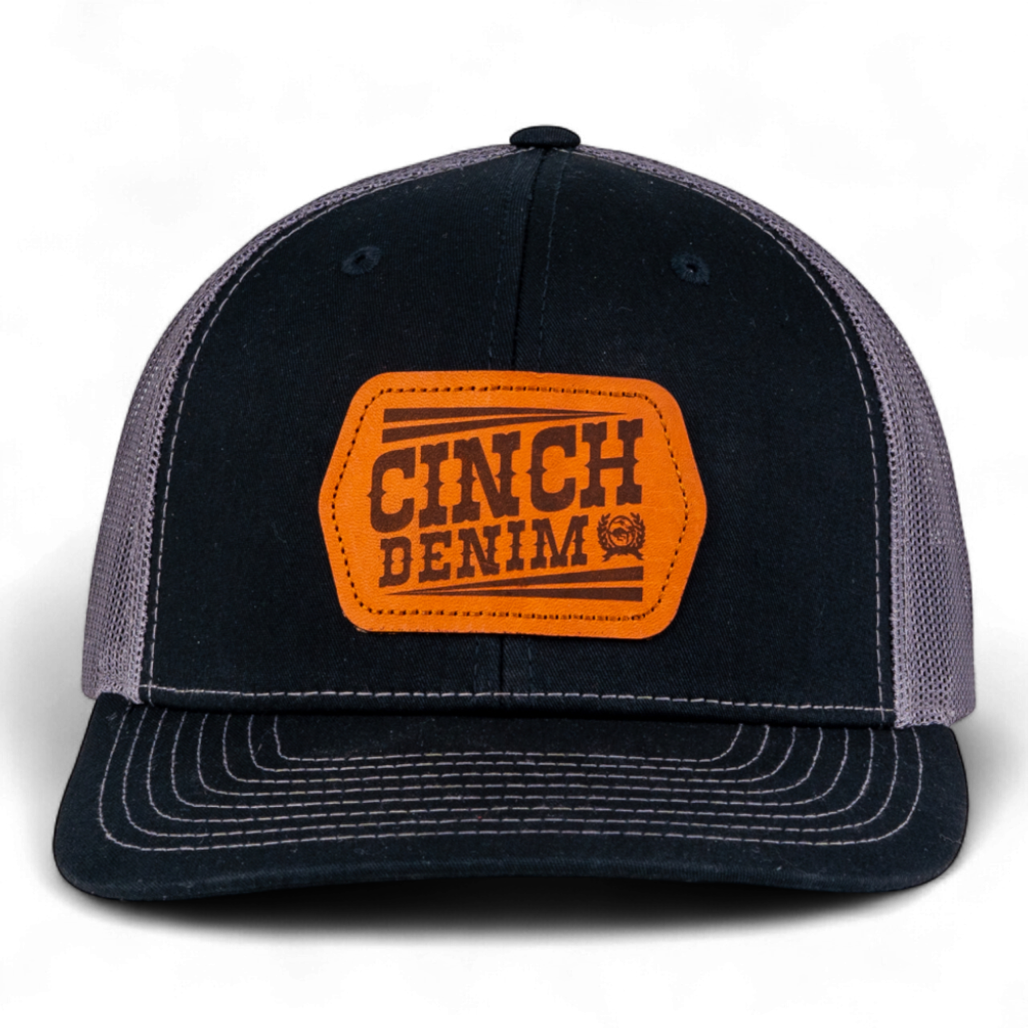 Black and gray cap with orange 'Cinch Denim' logo on a white background