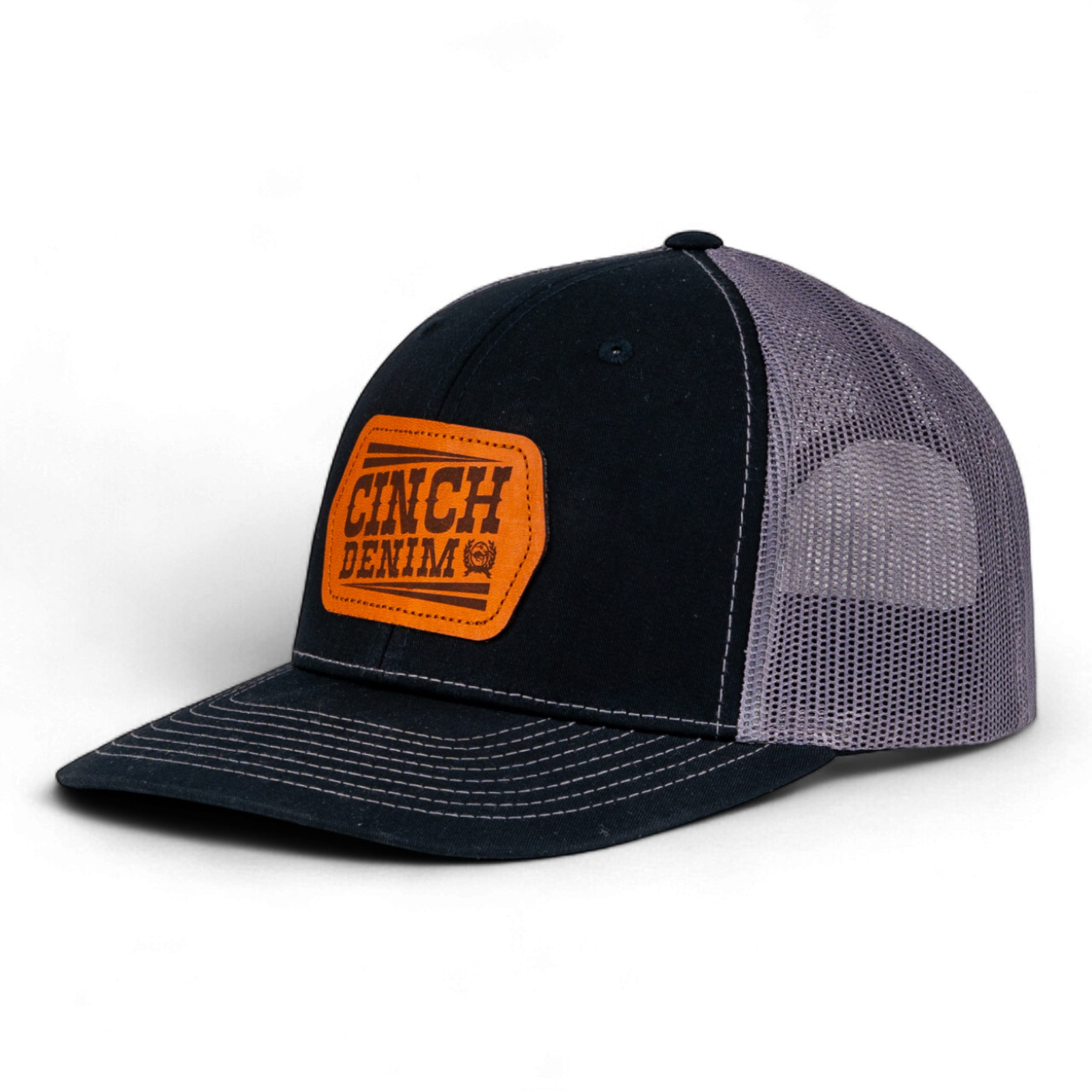 Black and gray cap with orange 'Cinch Denim' logo on a white background