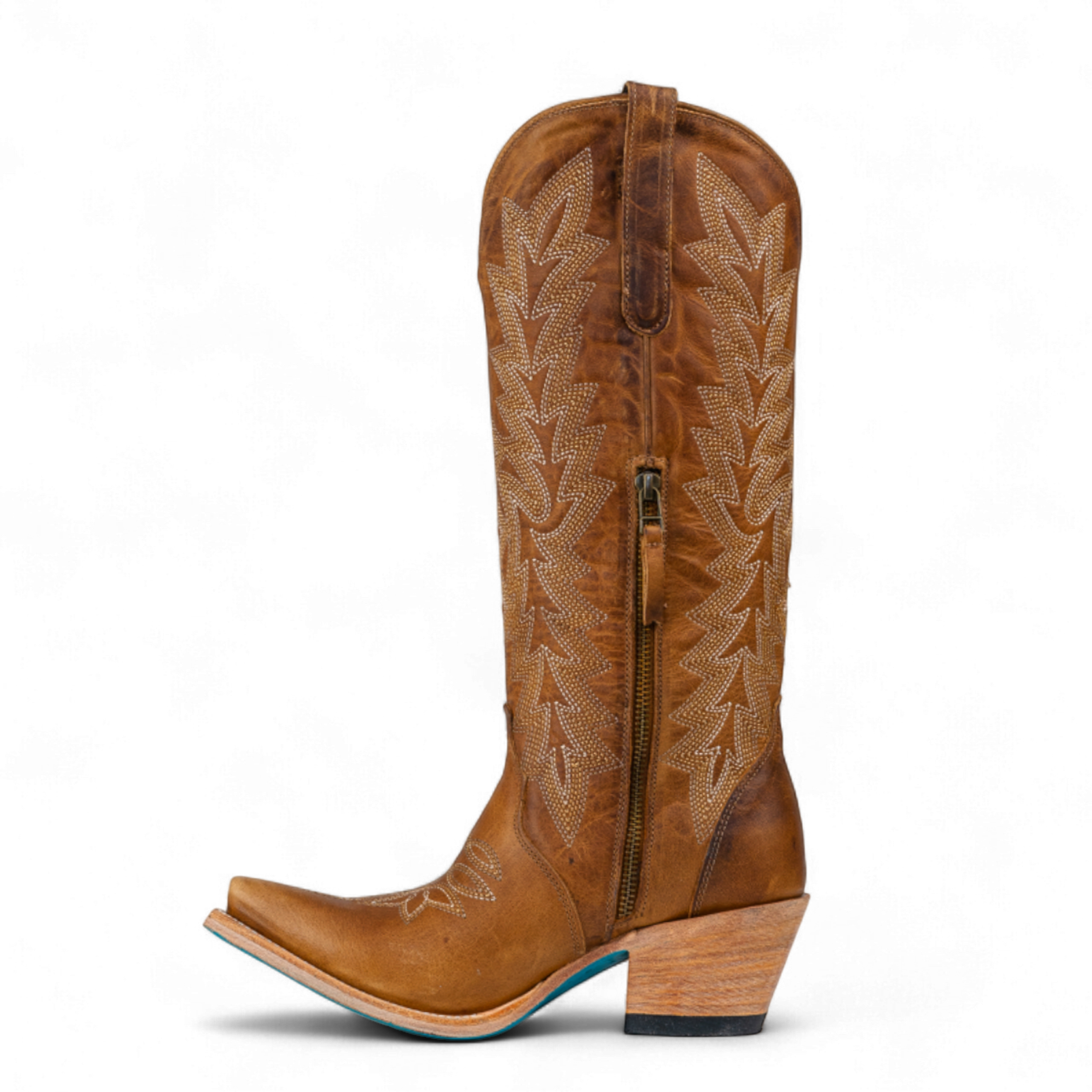 Brown cowboy boot with intricate embossing on a white background