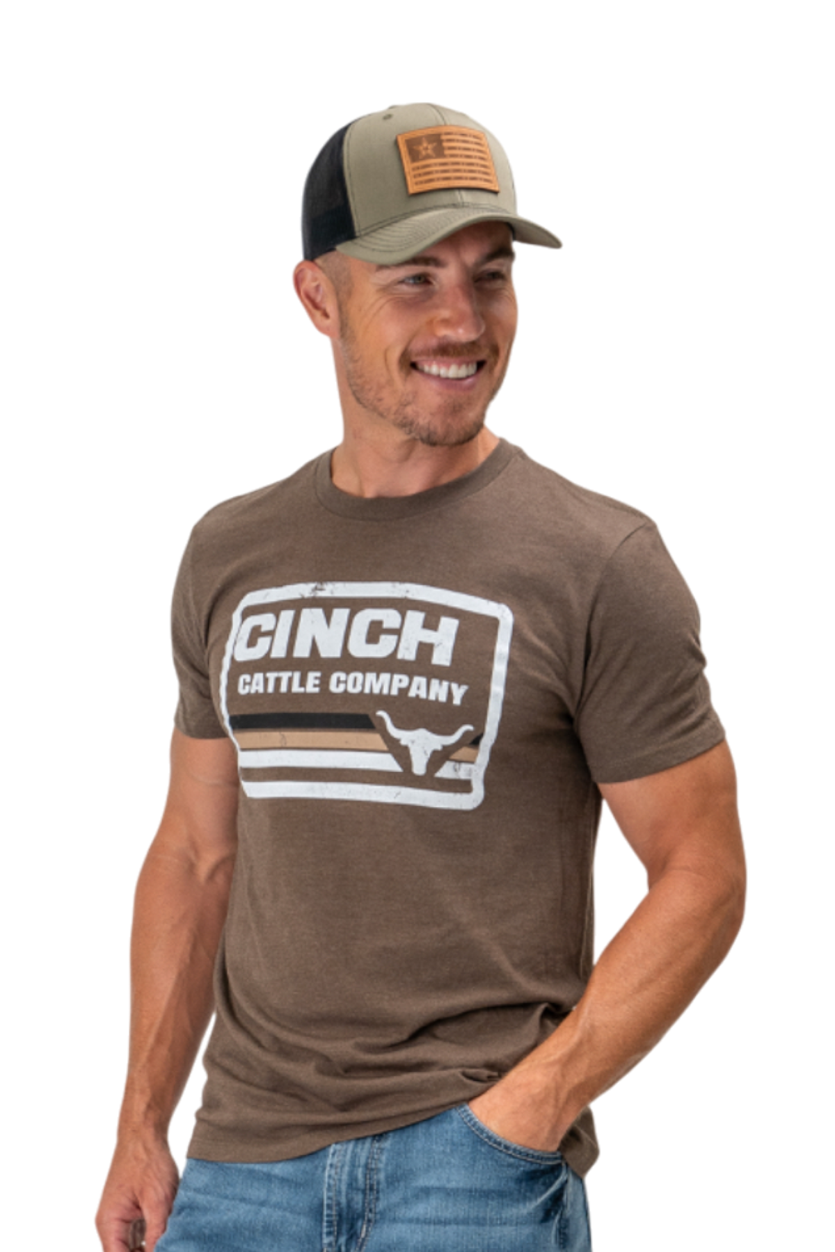 Man wearing a brown t-shirt with a large 'Cinch' graphic on the front, a hat, and blue jeans on a white background