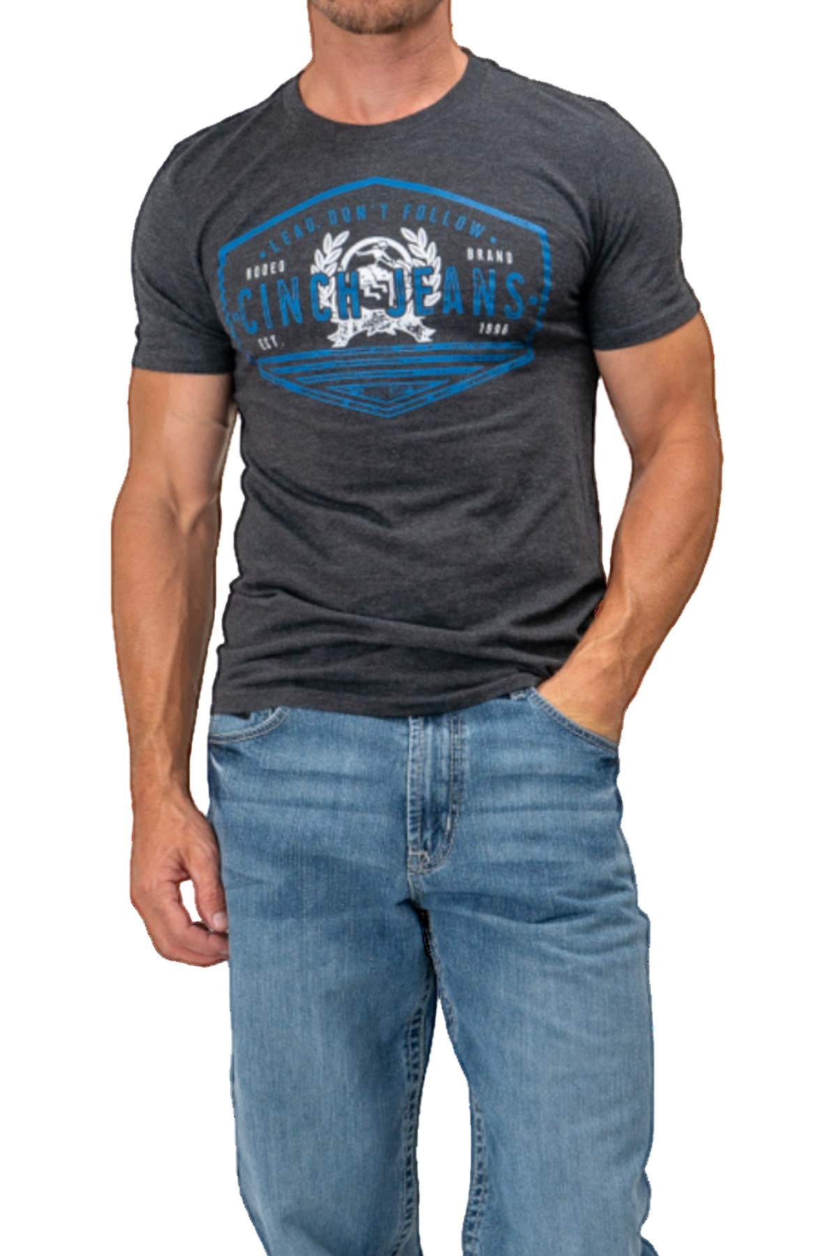 Man wearing a dark gray t-shirt with a blue graphic design and blue jeans on a white background