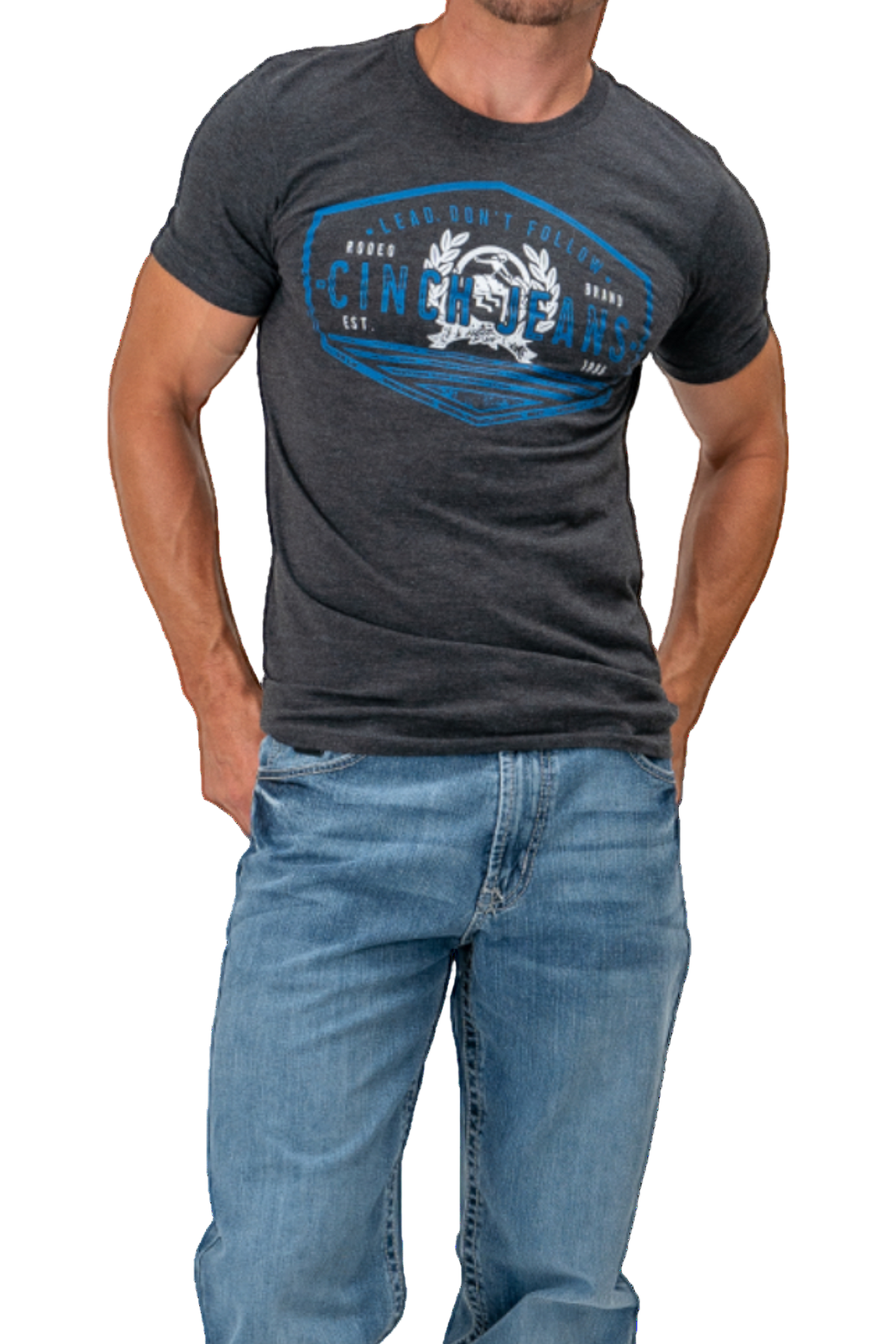 Man wearing a dark gray t-shirt with a blue graphic design and blue jeans on a white background