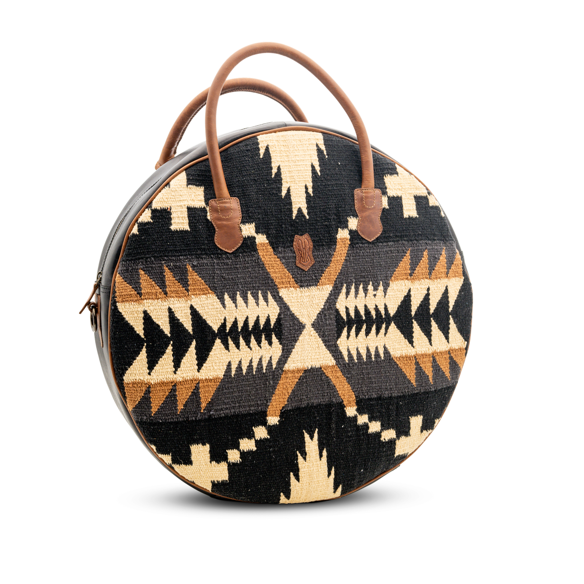 Round bag with tribal pattern and brown handles on a white background