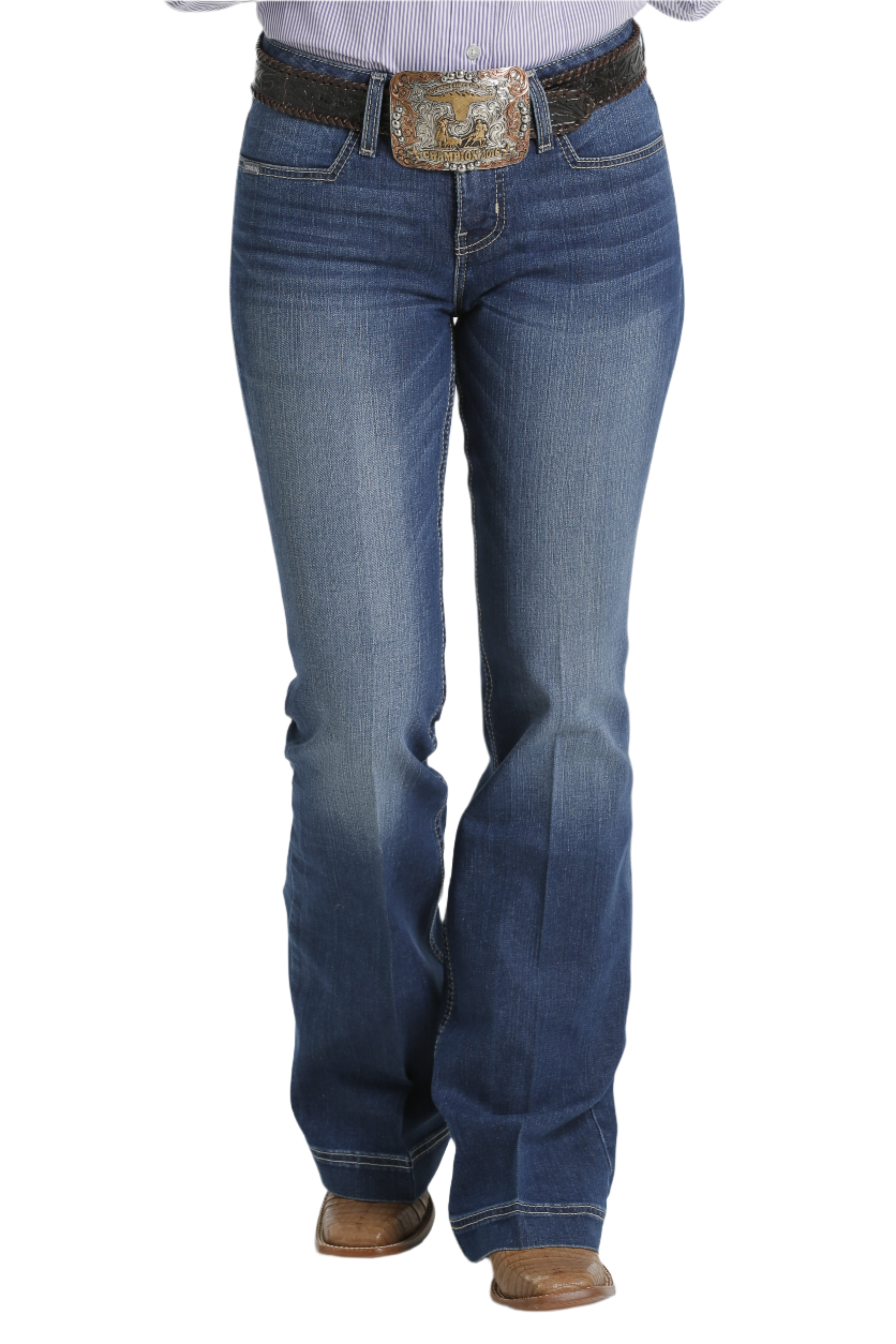 A pair of Cinch ladies slim trouser jeans with welt pockets in a medium stonewash color, including a belt and shoes.