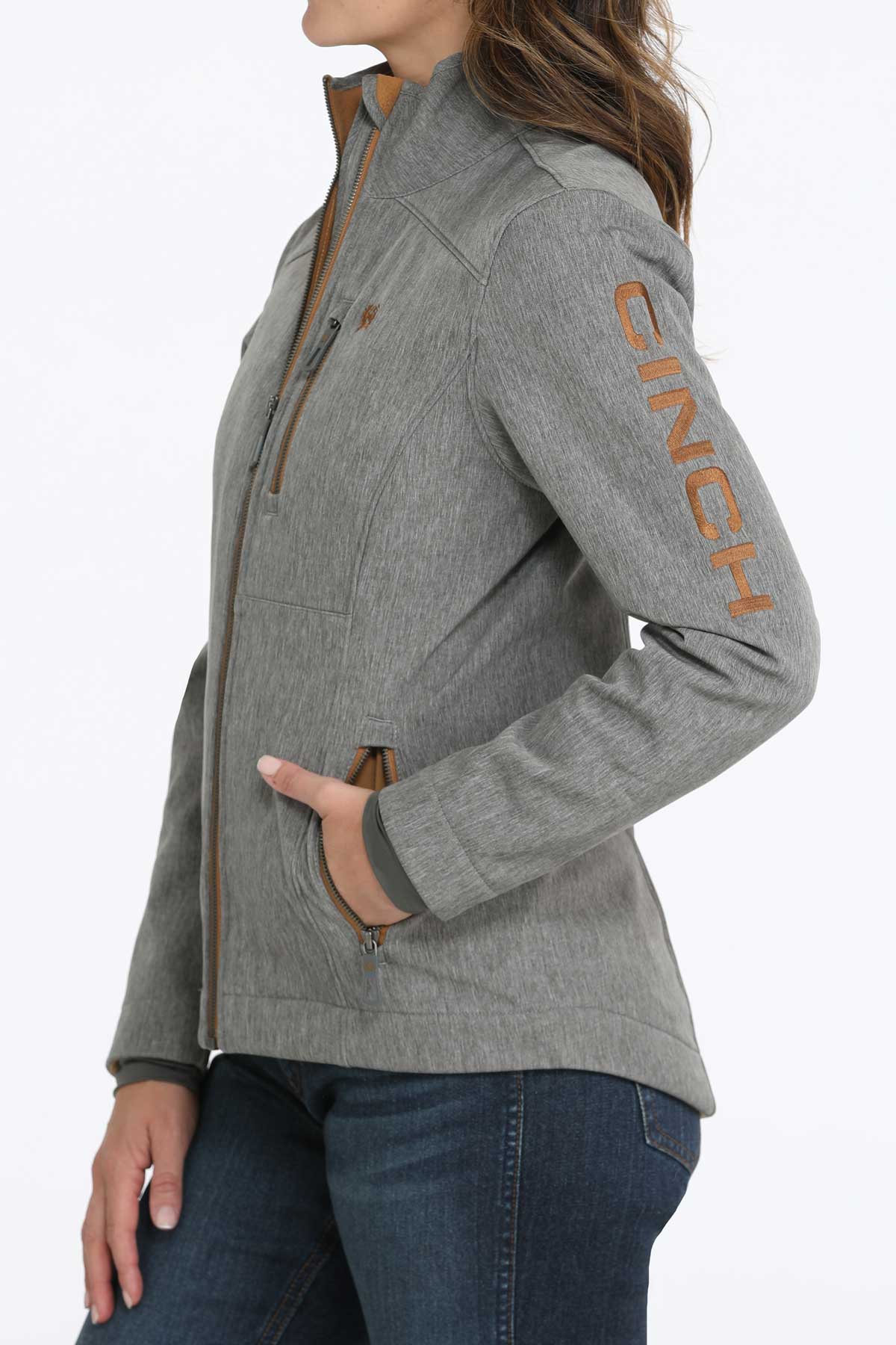 Woman wearing a gray jacket and jeans