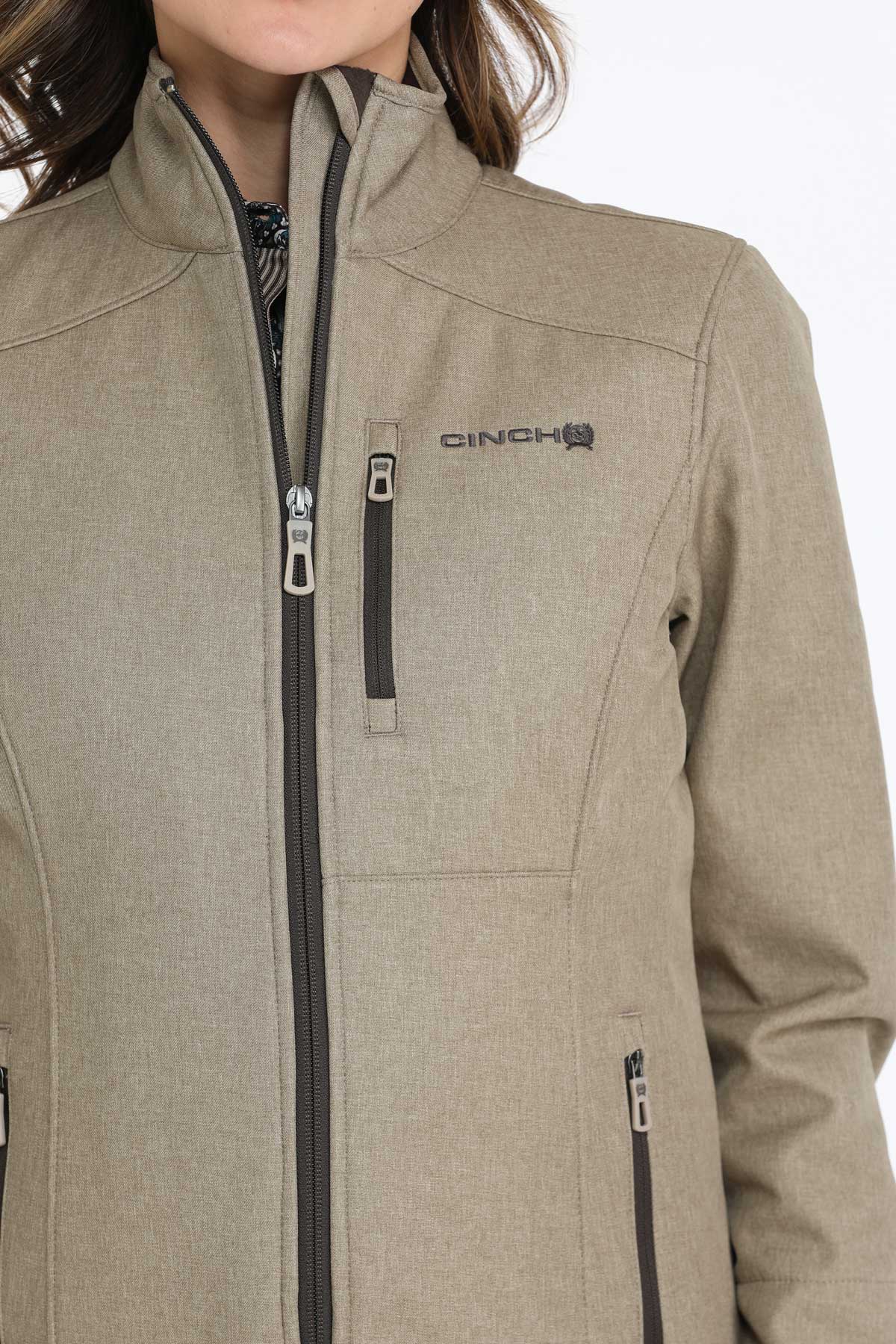 Close-up of a woman wearing a khaki jacket