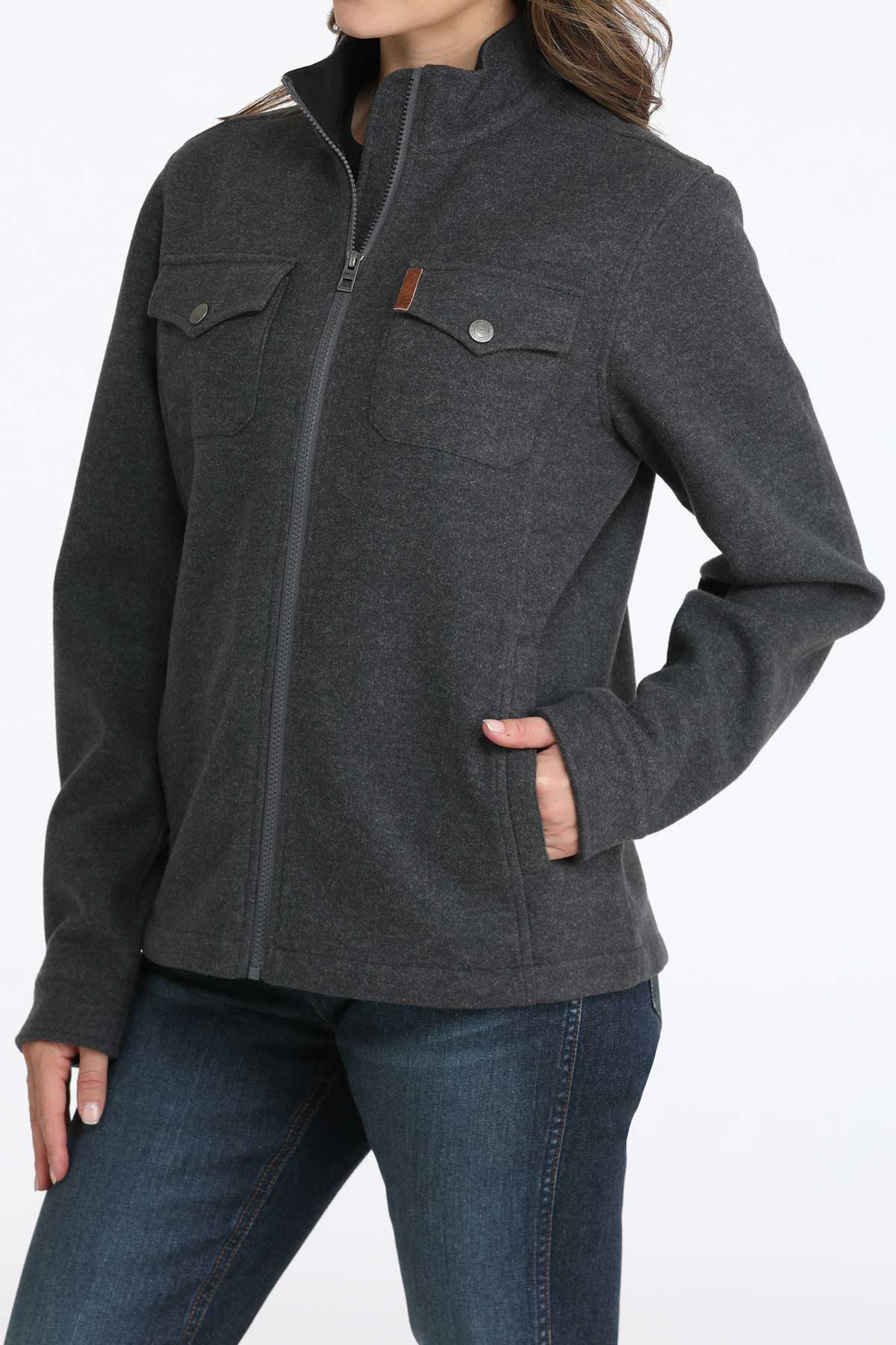 Woman wearing a gray jacket with jeans