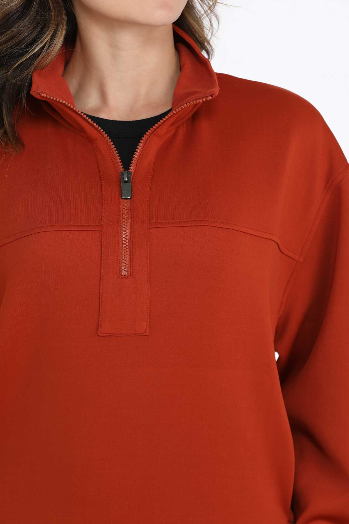 Close-up of quarter-zip neckline on red Cinch ladies’ sweatshirt