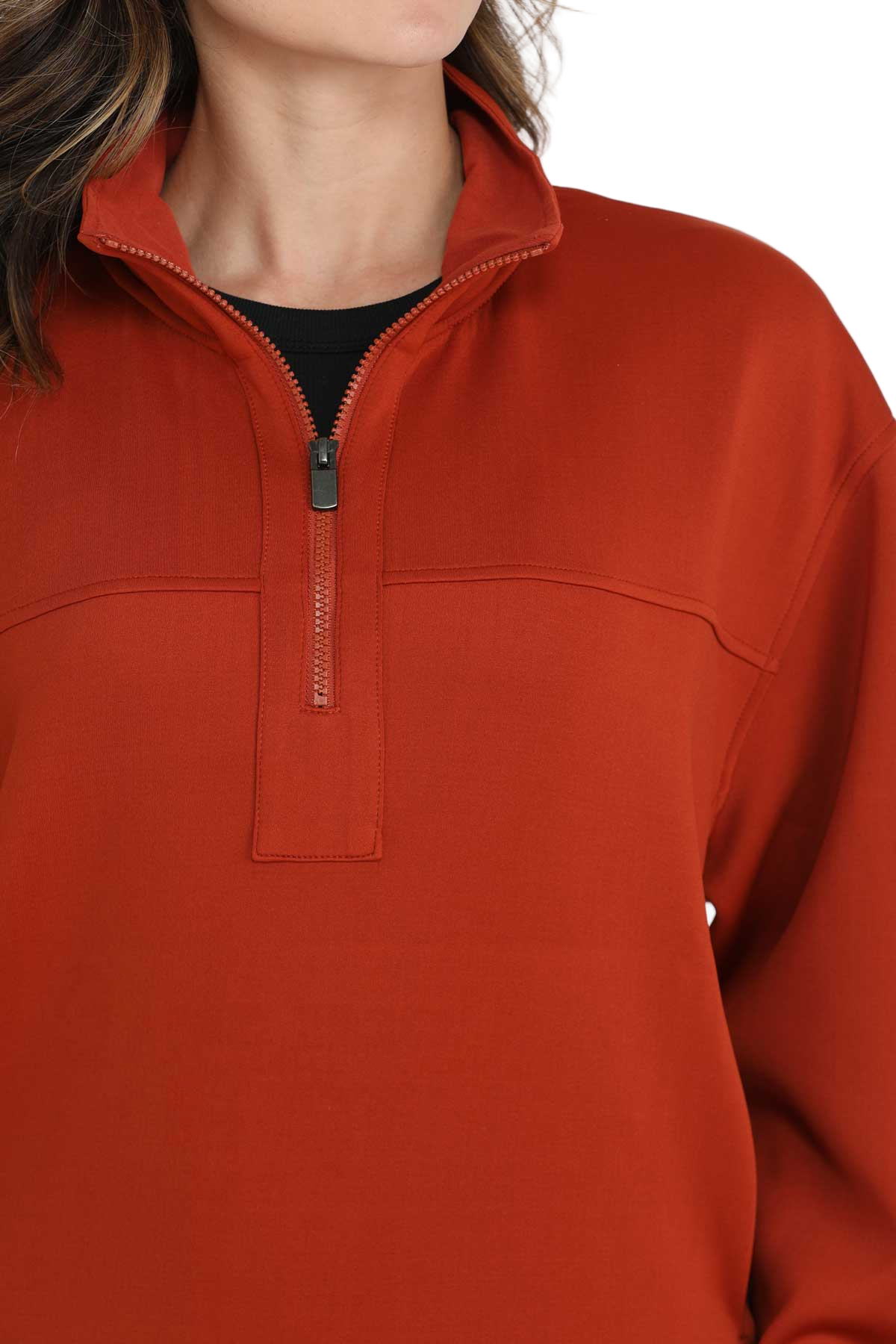 Woman wearing a red quarter-zip pullover