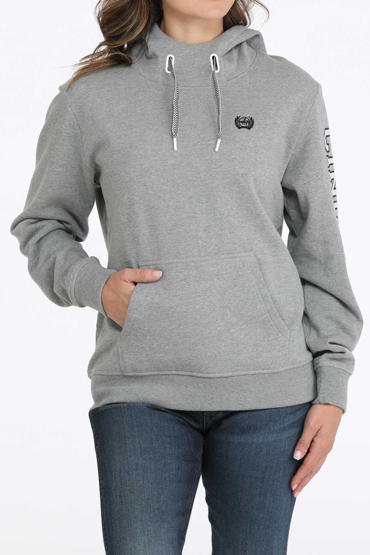 Gray hoodie worn by a person on a white background