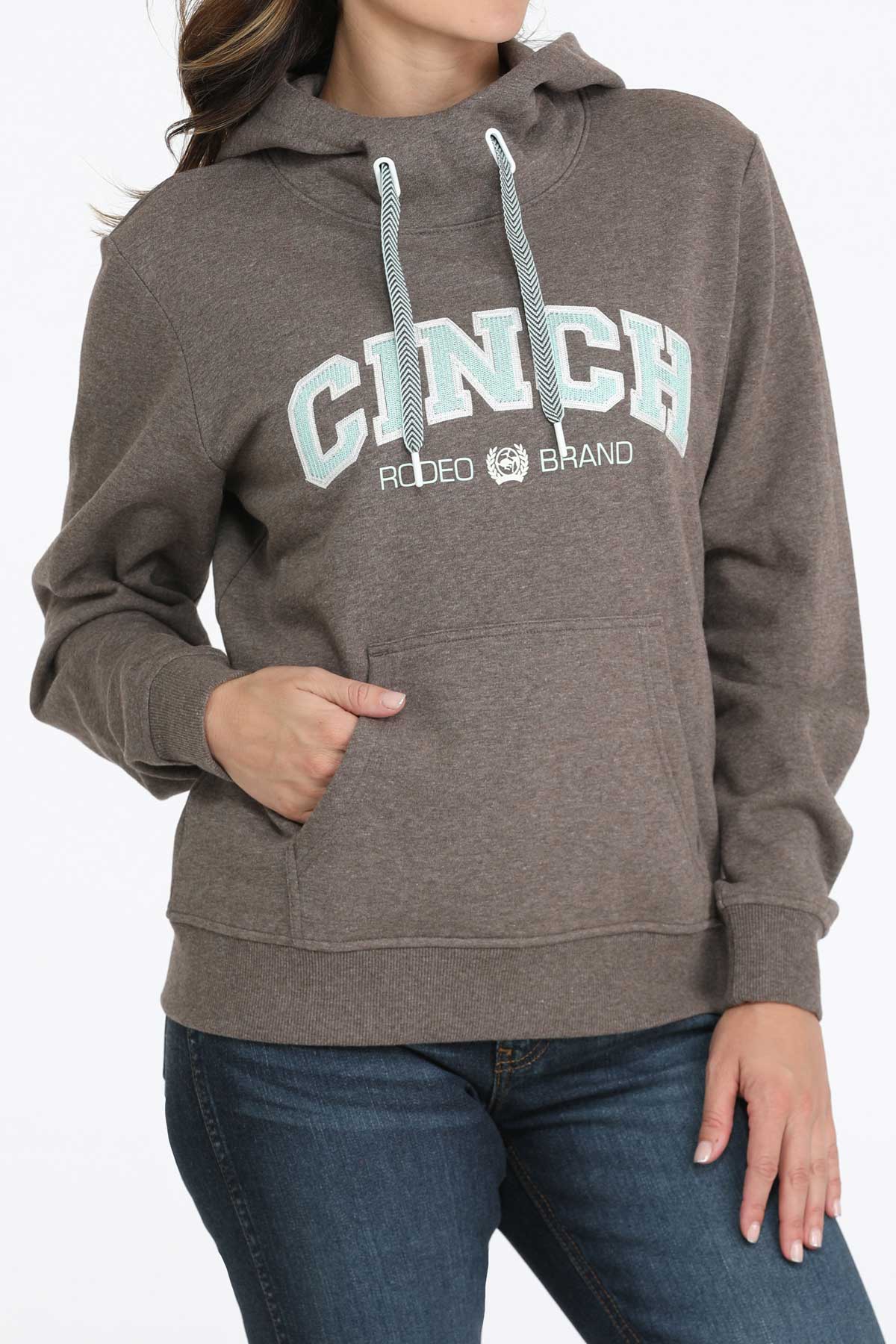 Person wearing a Cinch hoodie with a white background