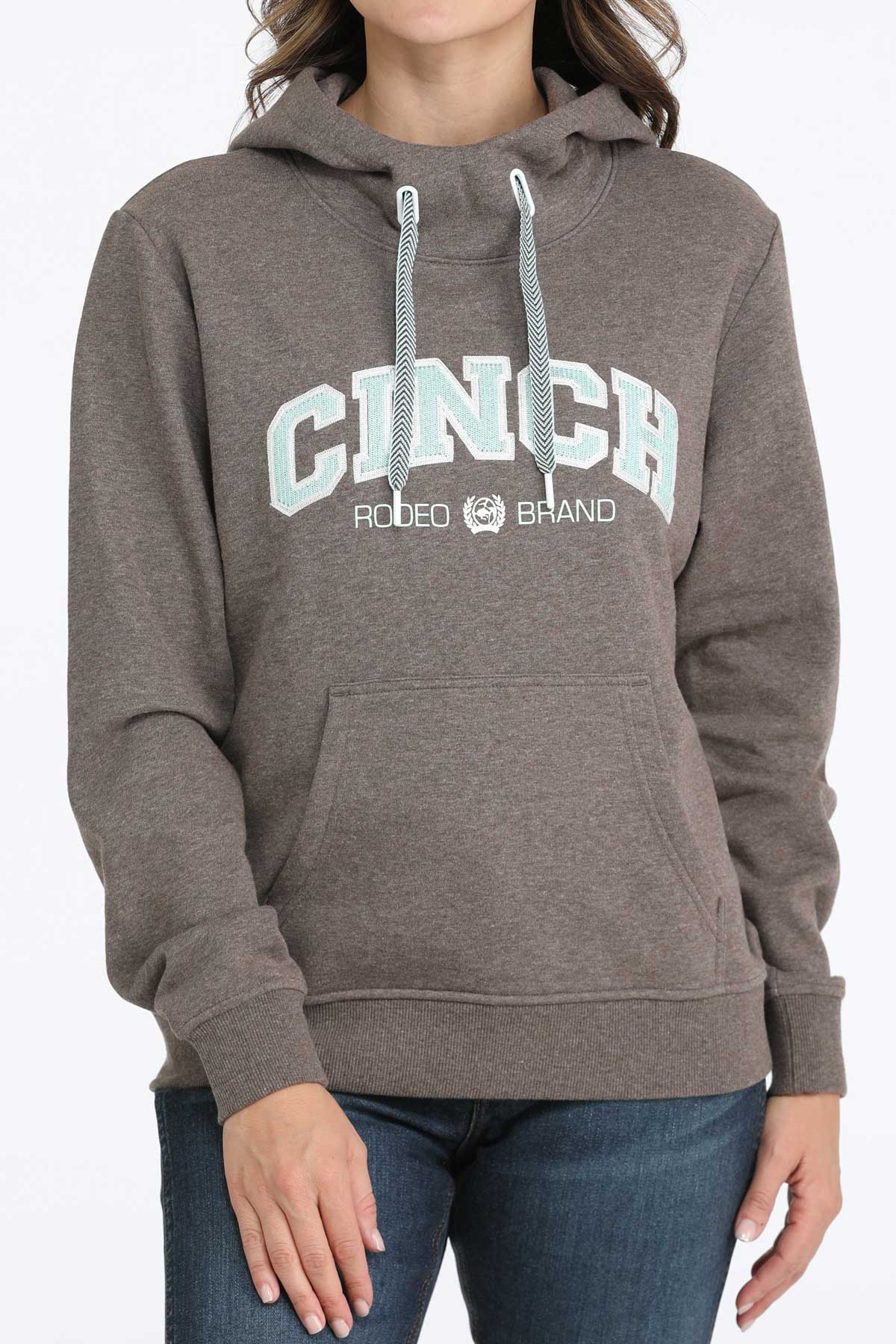 Person wearing a brown hoodie with 'Cinch Rodeo Brand' logo on a white background