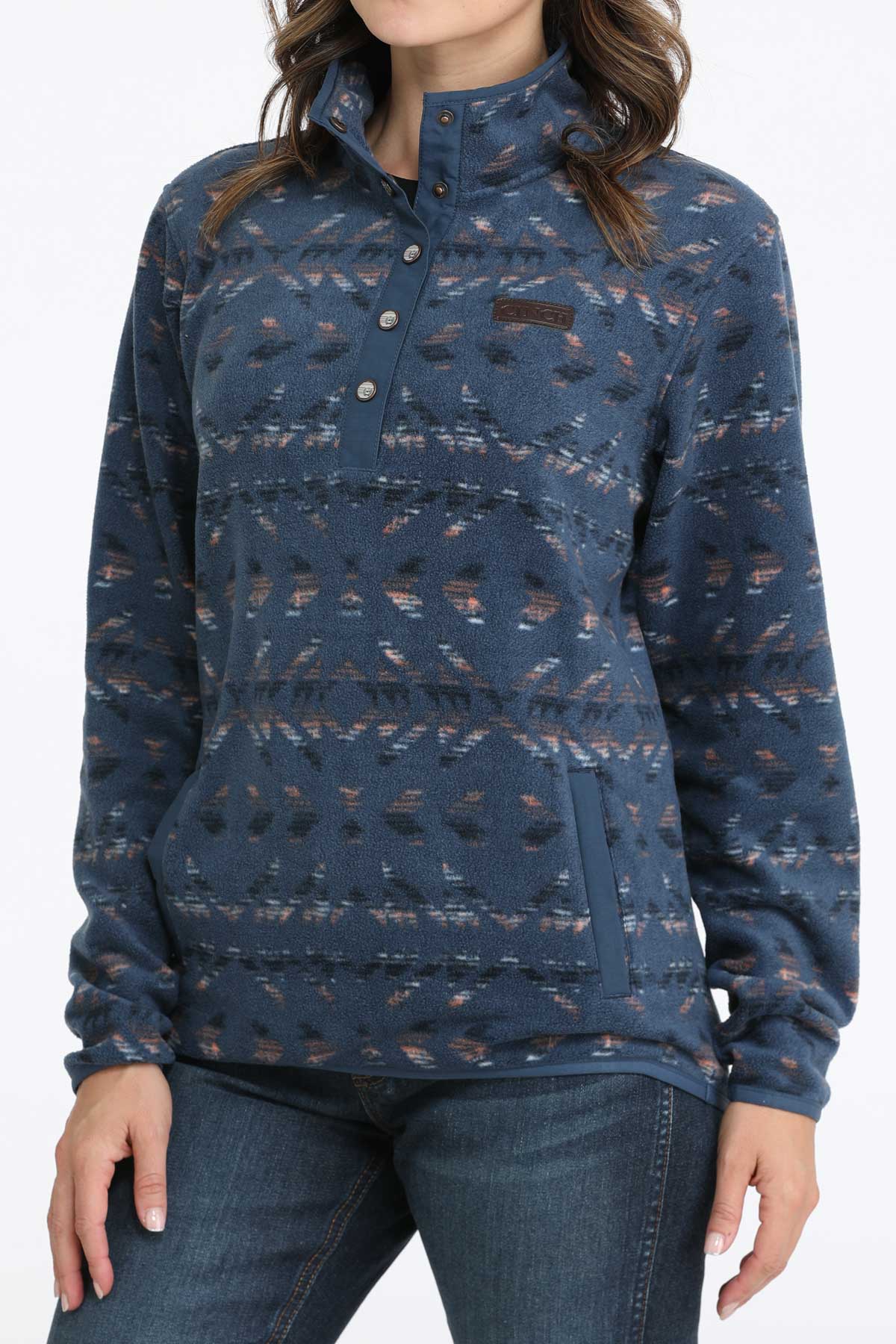 Woman wearing a blue fleece pullover with jeans