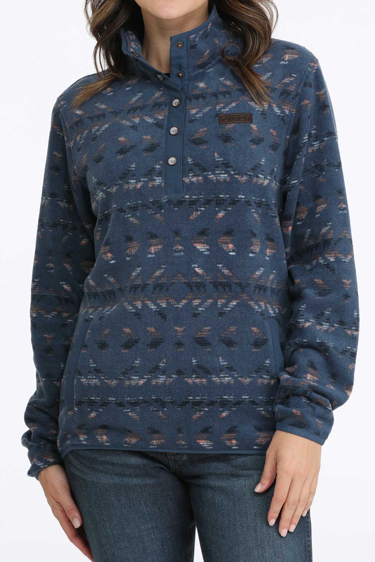 Woman wearing a blue fleece pullover with jeans