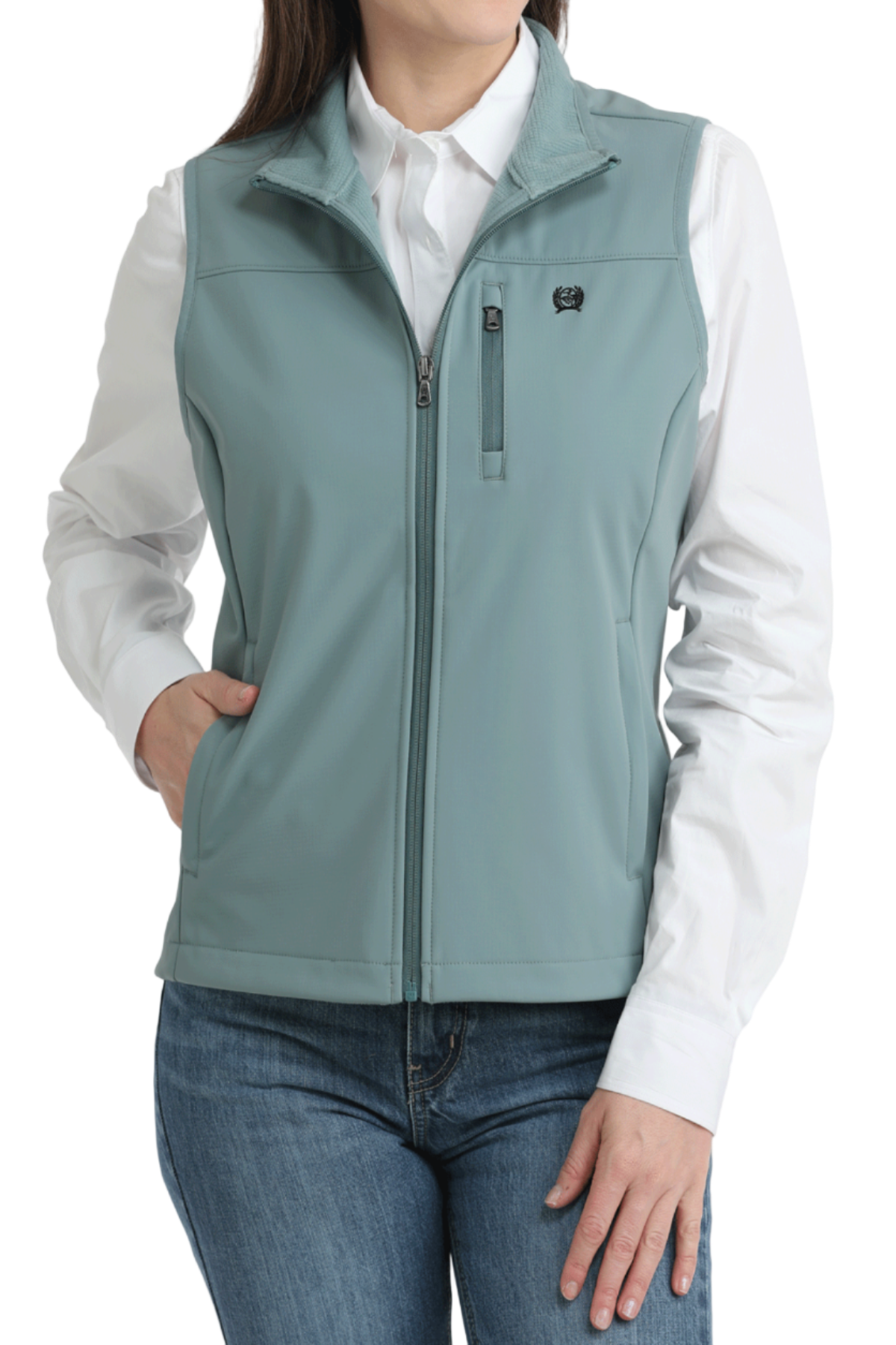 Person wearing a light blue vest over a white shirt and jeans on a white background