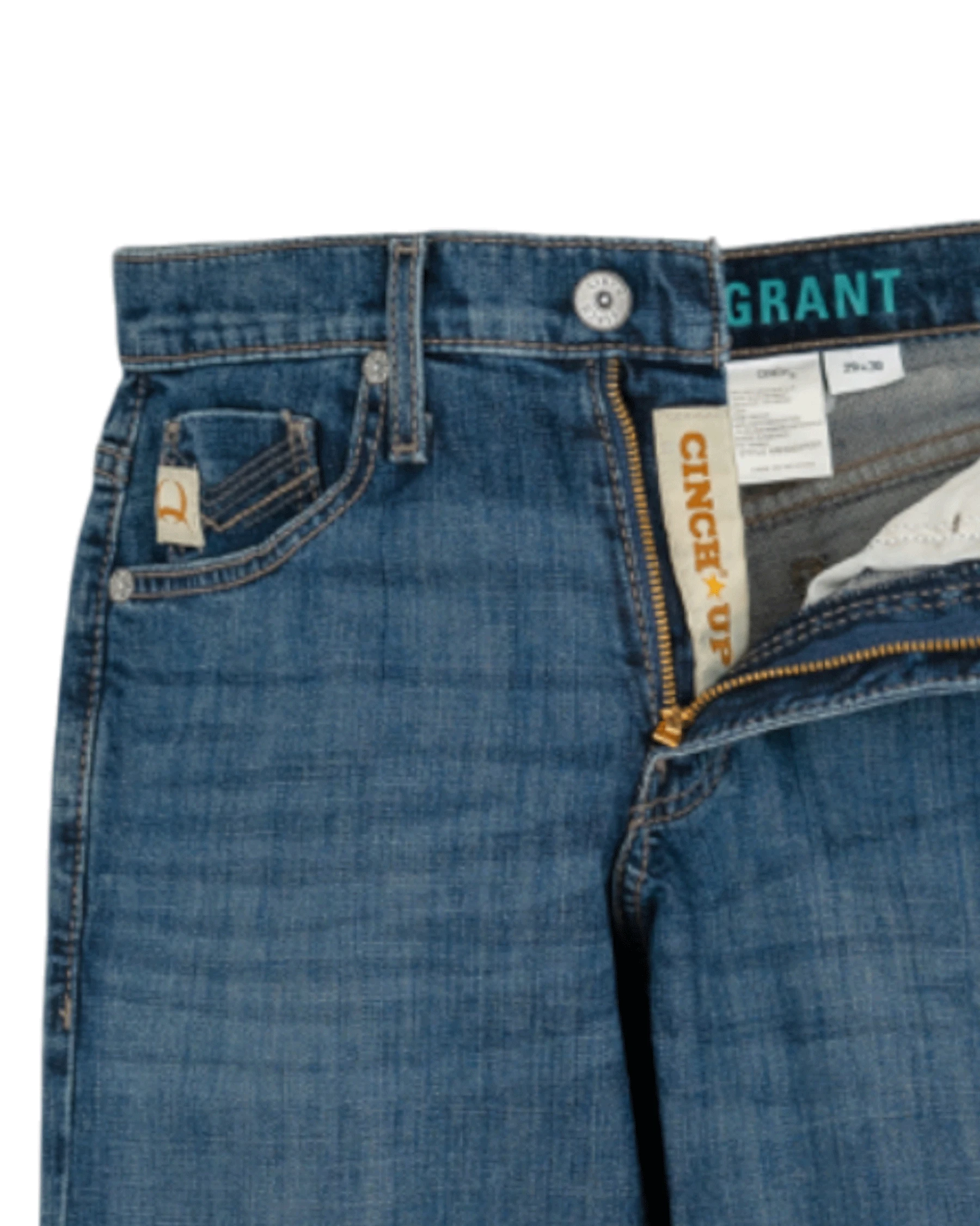 Close-up of the front of blue denim jeans with light fading, featuring a coin pocket with a small embroidered patch, belt loops, and a button closure with a zipper fly