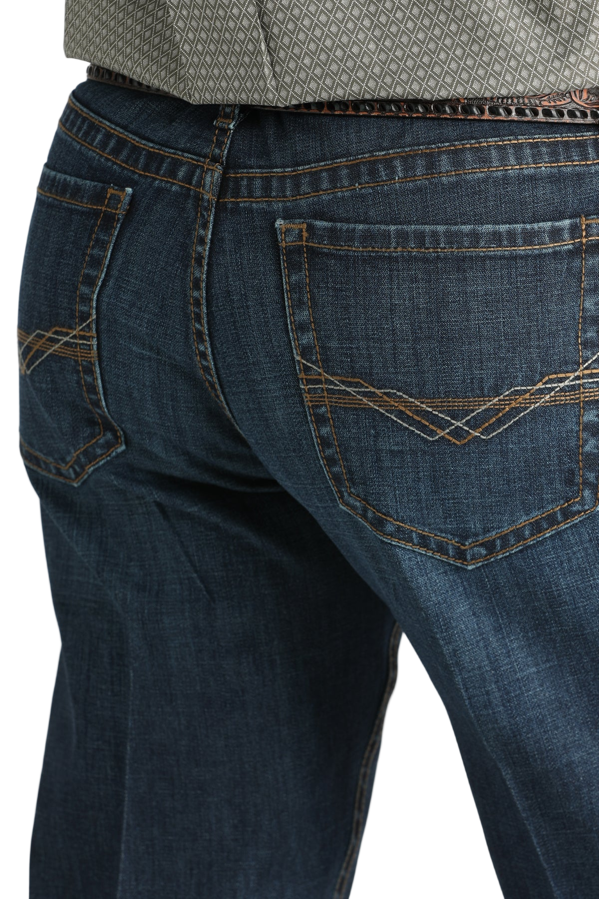 Close-up of blue jeans with a white background