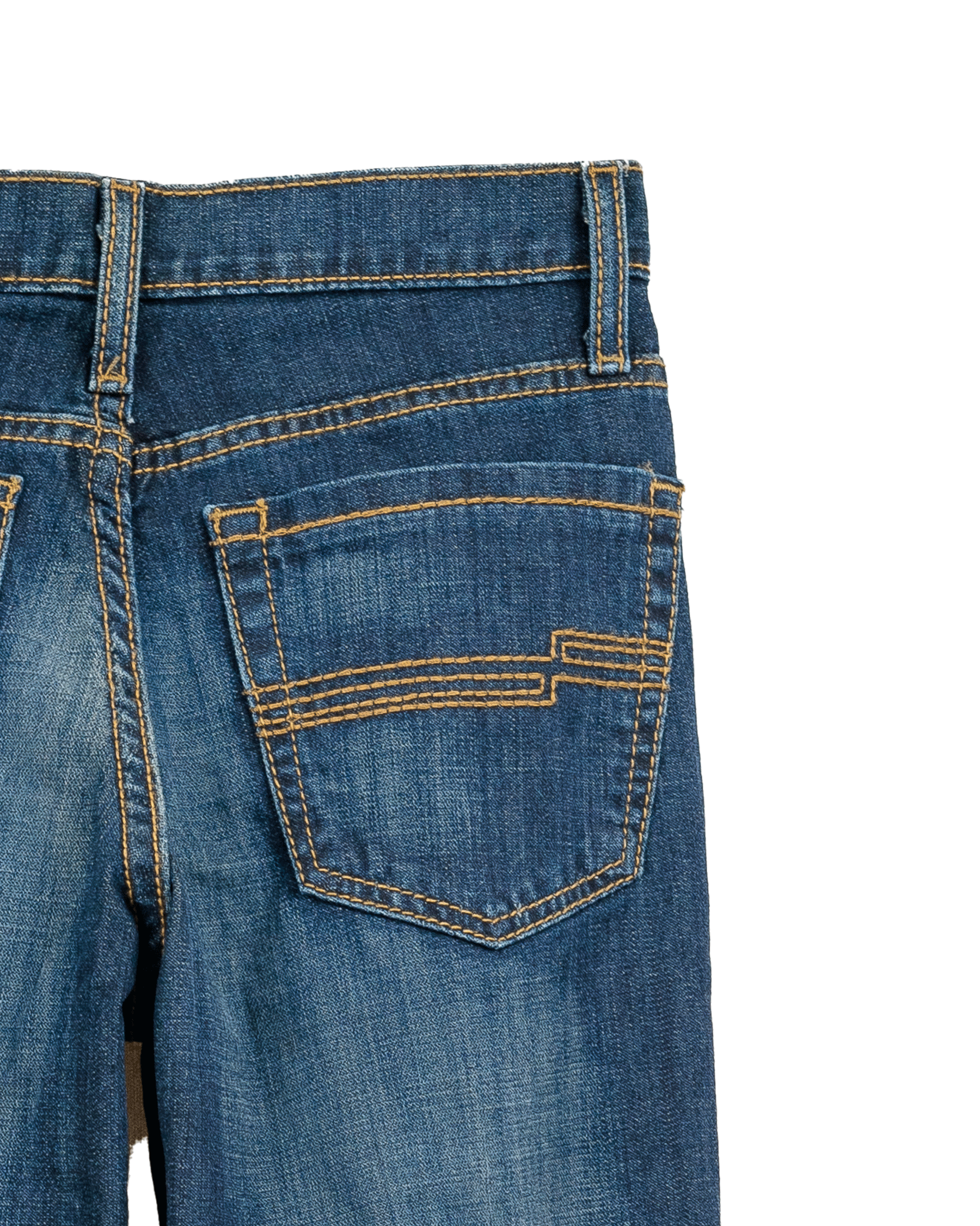 Close-up of blue jeans with a white background