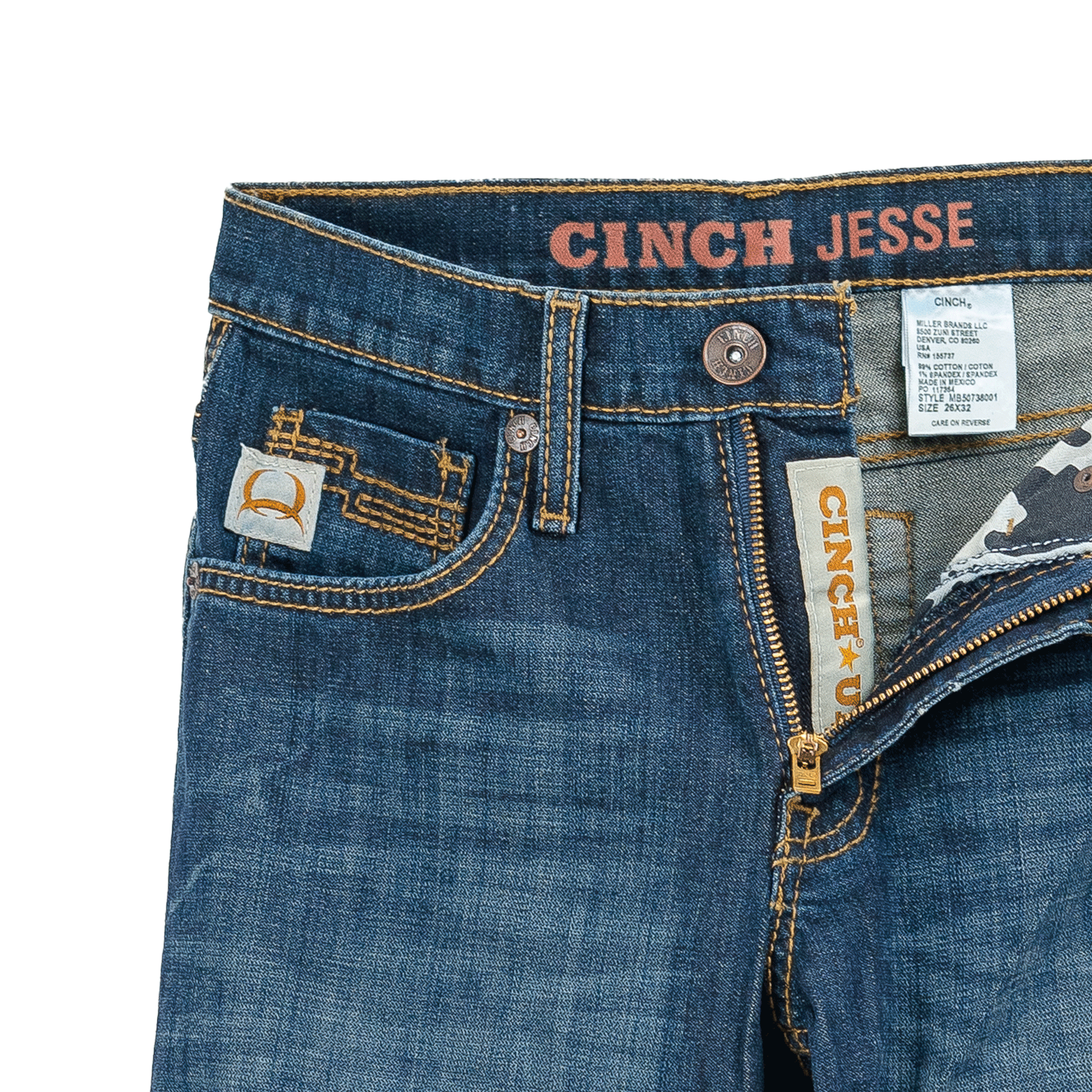 A pair of medium wash denim jeans with a partially unzipped fly, showcasing a Cinch logo on the inner waistband and a stitched patch above the coin pocket.
