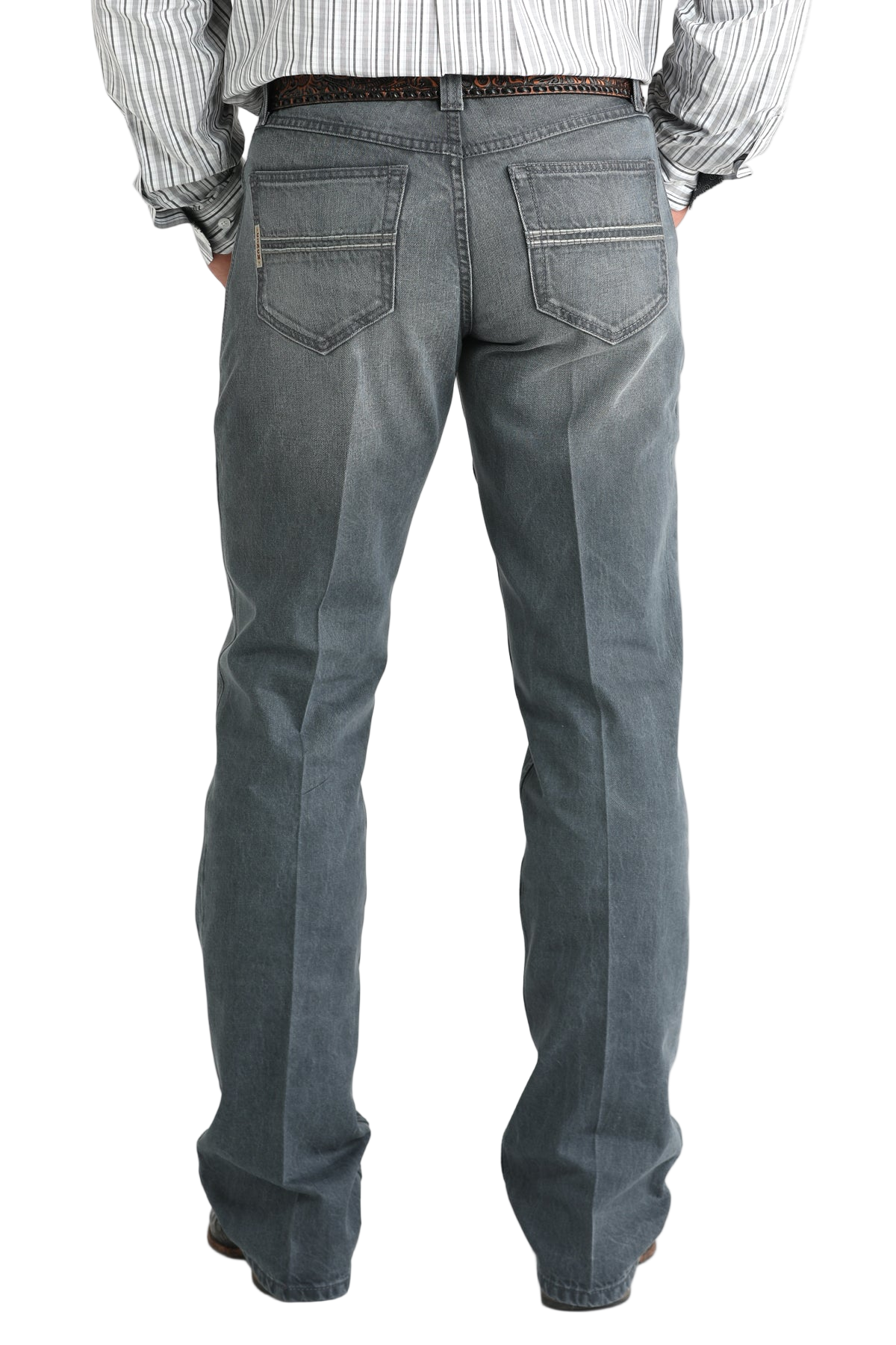Person wearing gray jeans on a white background