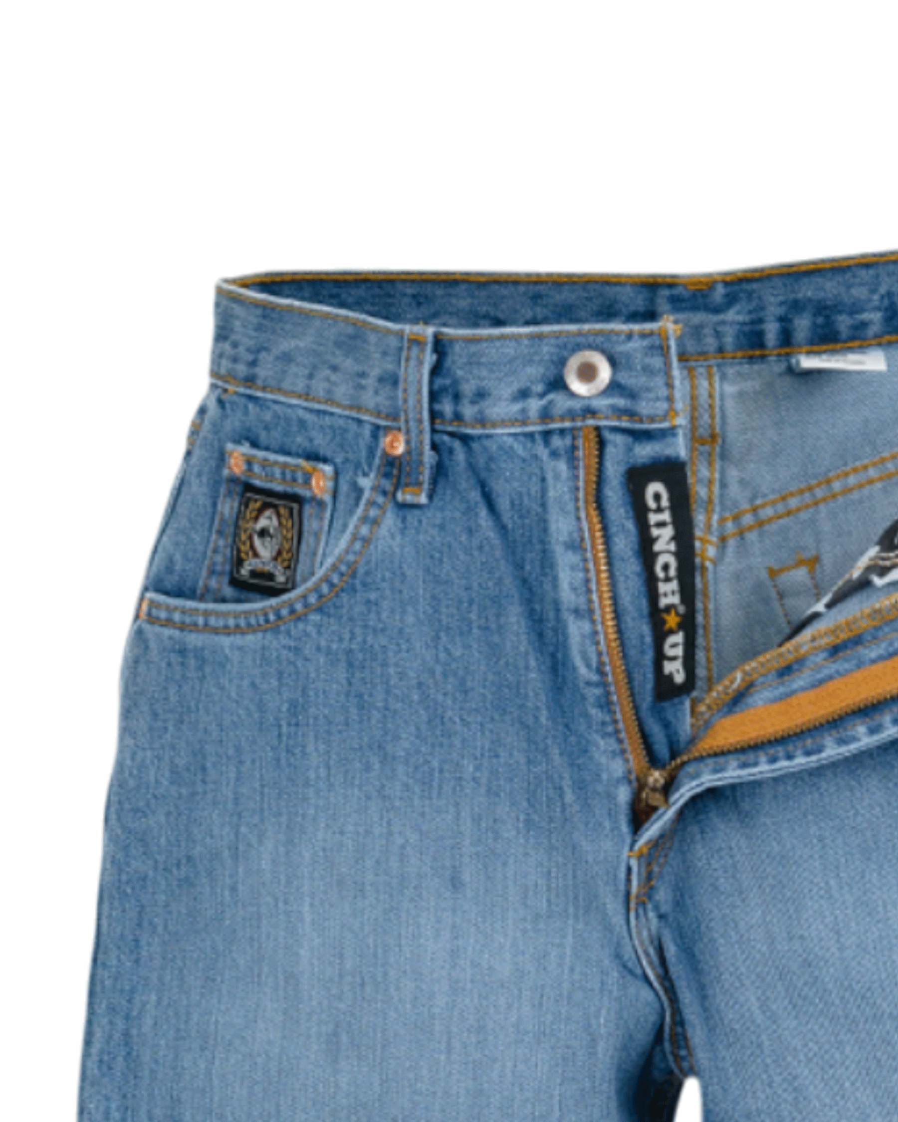 Close-up of blue jeans with a brand label on a white background