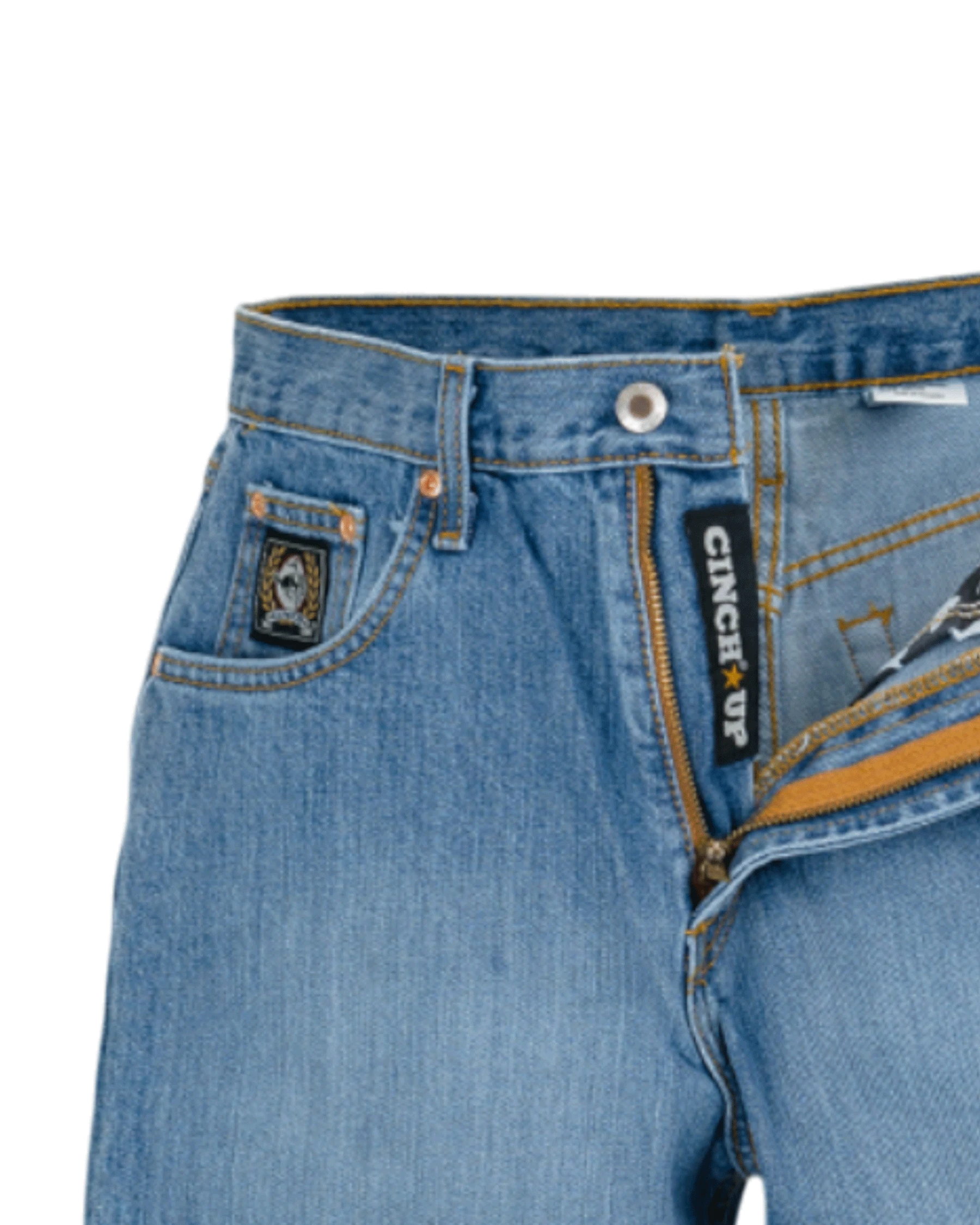 Close-up of blue jeans with a brand label on a white background