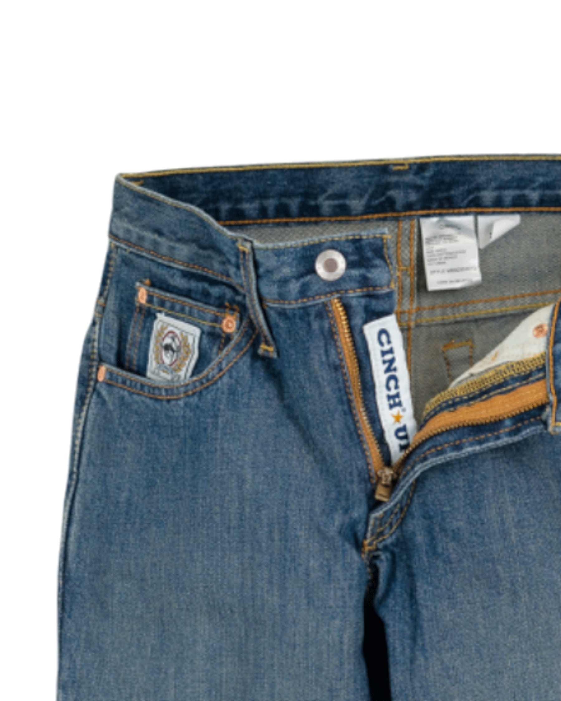 Close-up of blue jeans with Cinch branding on a white background