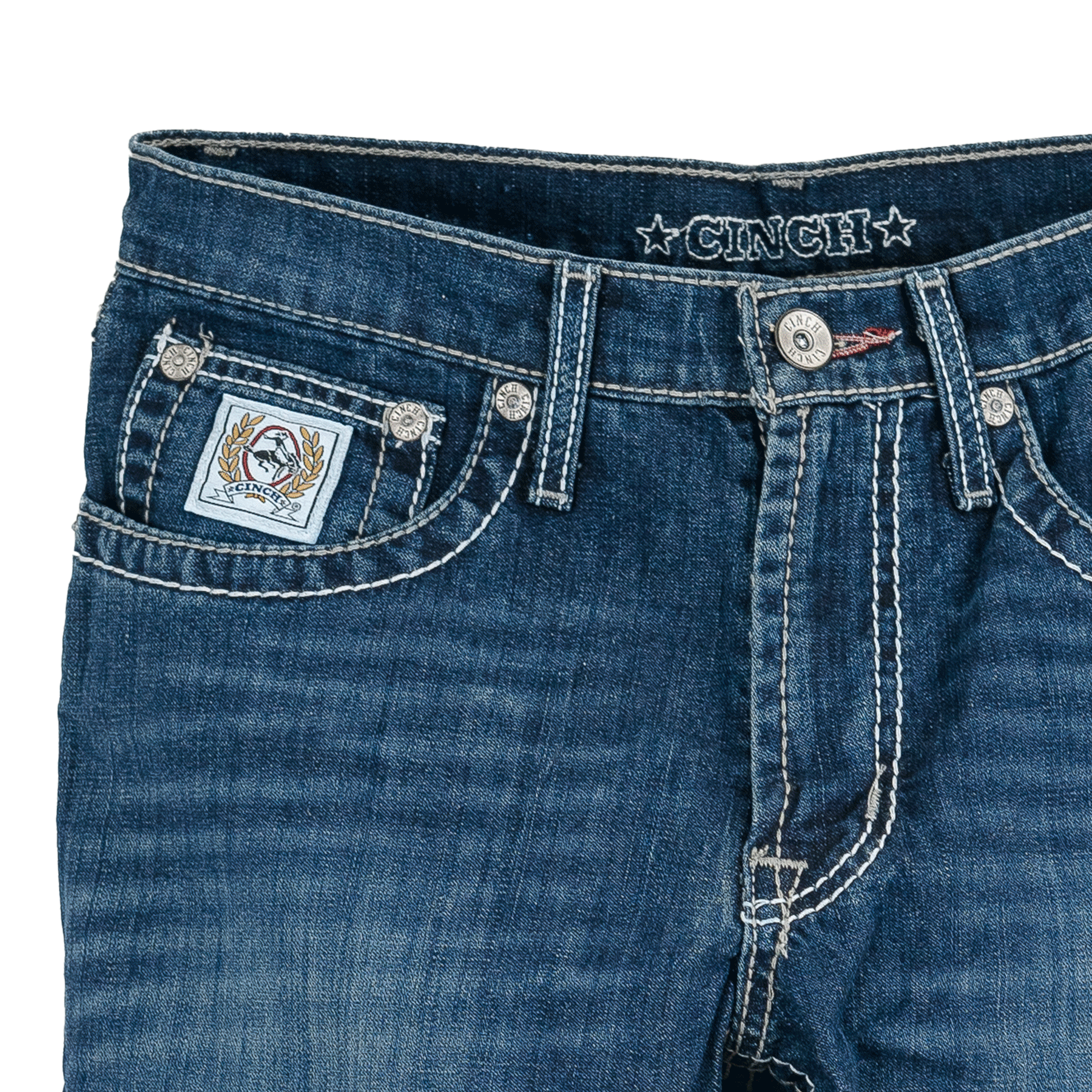 Close-up of blue jeans with brand logo on a white background