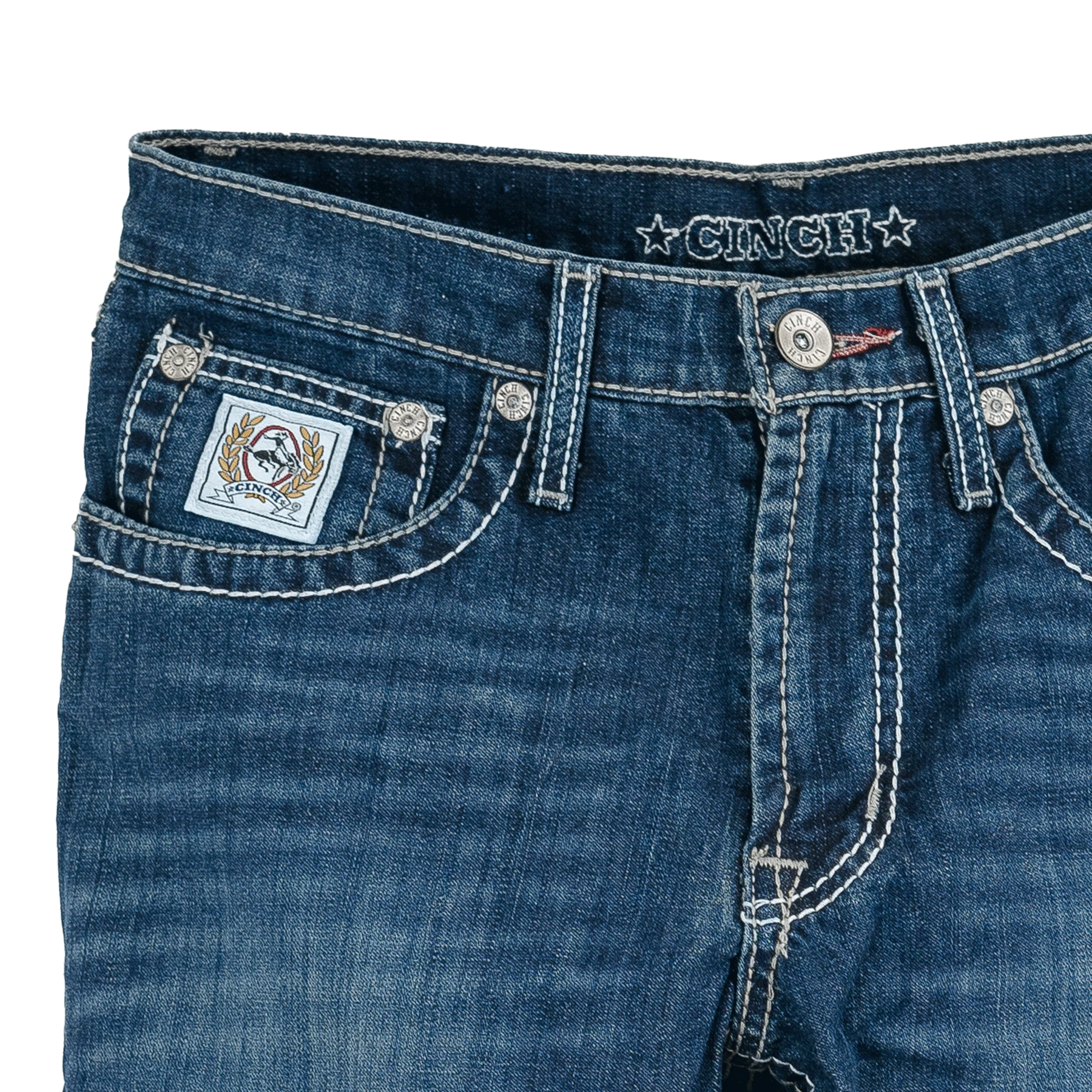 Close-up of blue jeans with brand logo on a white background