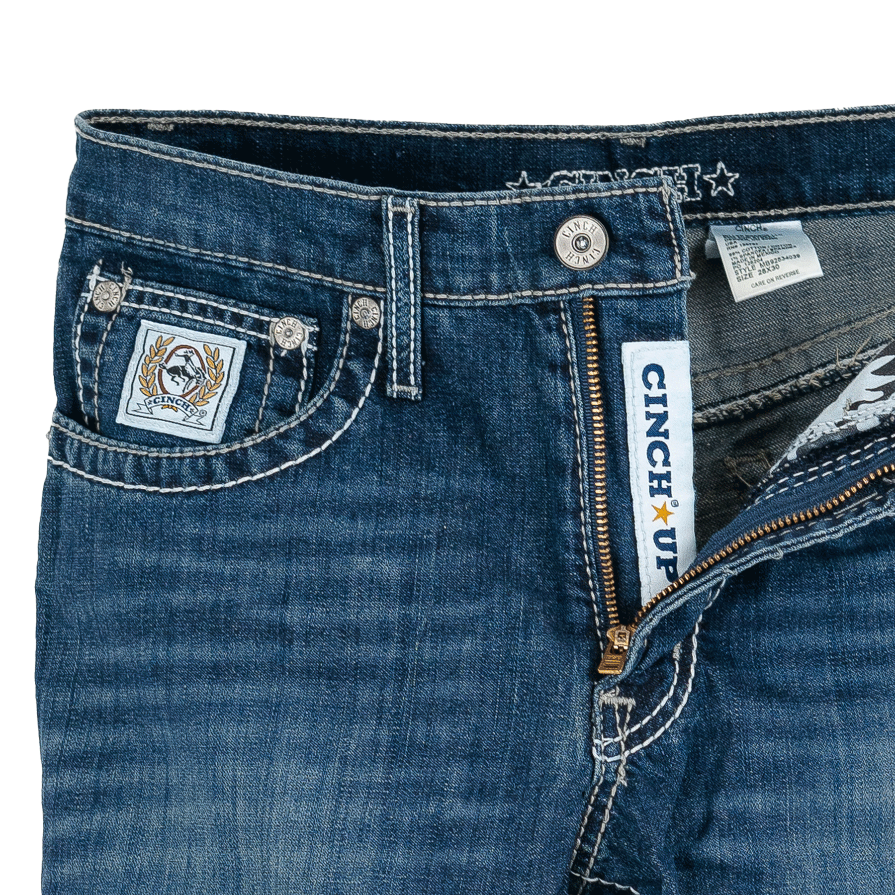 Close-up of blue jeans with brand labels and details.