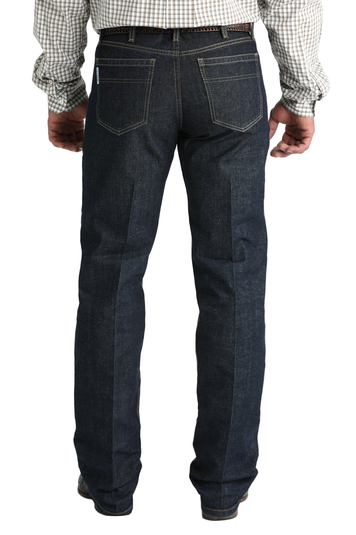 Back view of a man wearing dark blue denim jeans, and a belt, with a tucked-in patterned shirt