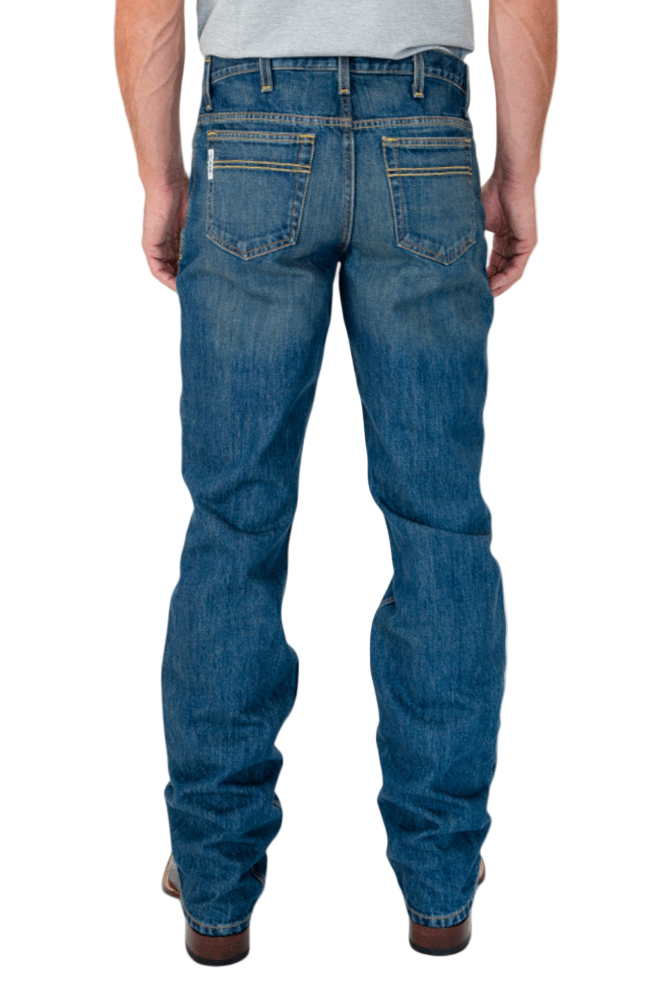 Blue jeans worn by a person on a white background