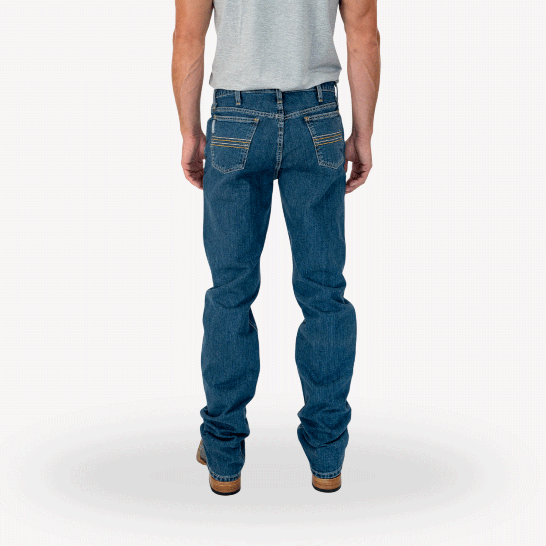 Back view of a man wearing blue jeans with a gray t-shirt tucked in