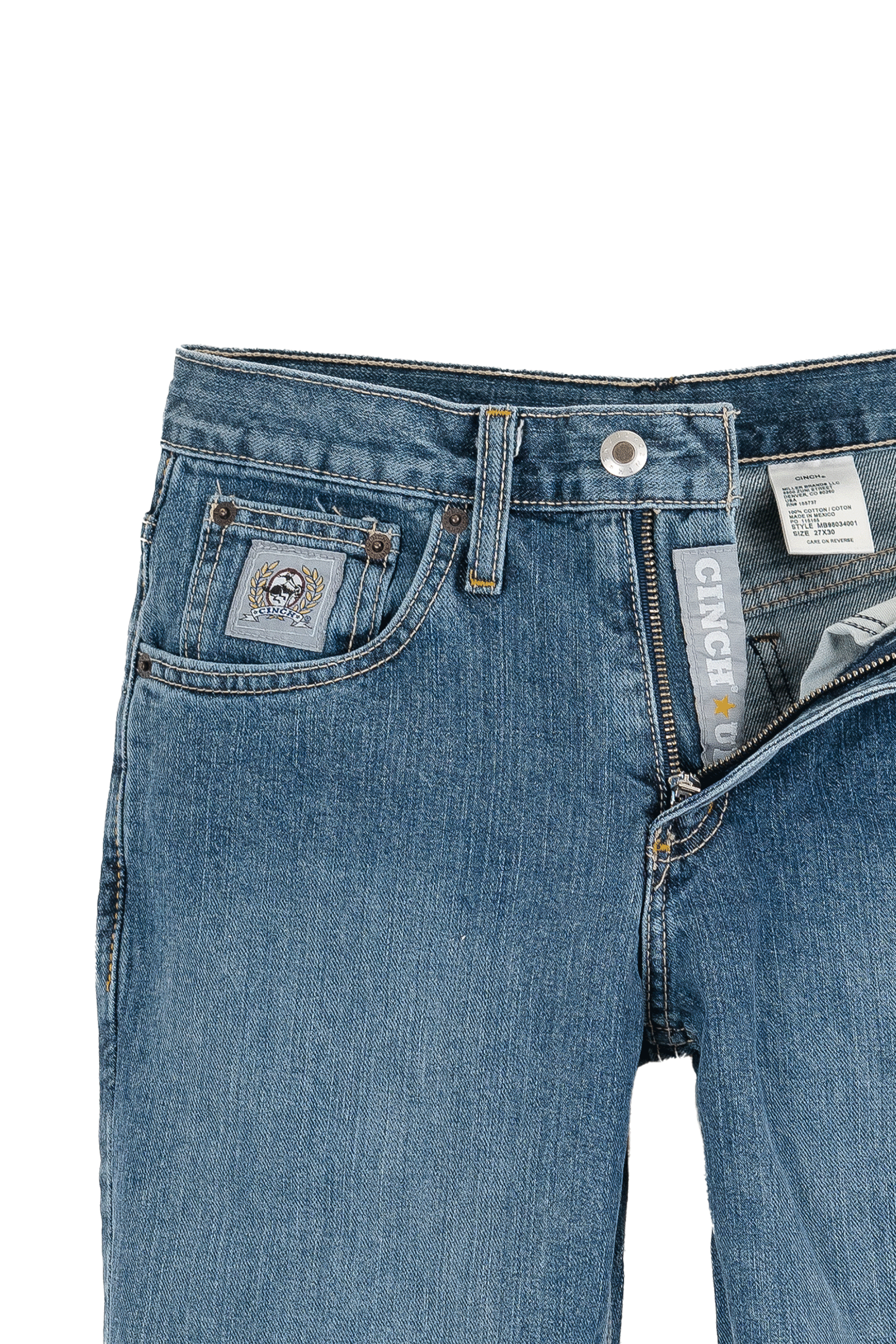 Close-up of blue jeans with Carhartt branding on a white background