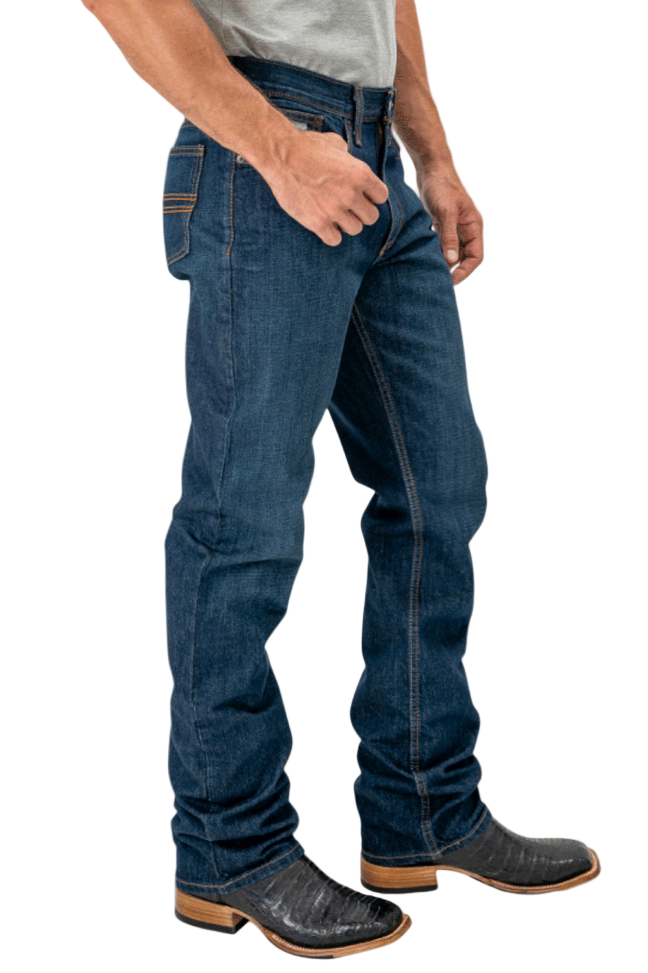 Person wearing blue jeans and brown boots on a white background