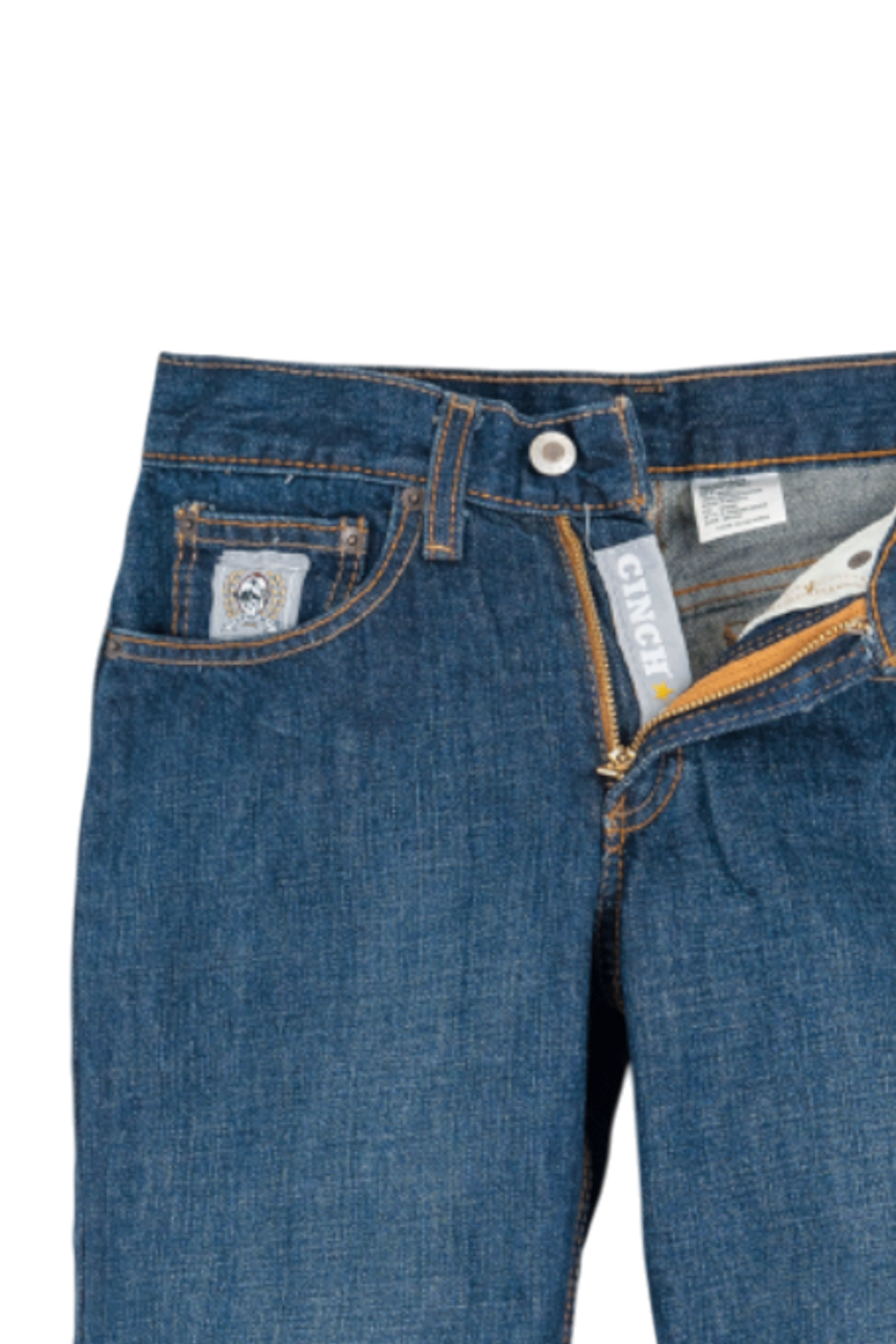 Close-up of blue jeans with brand labels on a white background