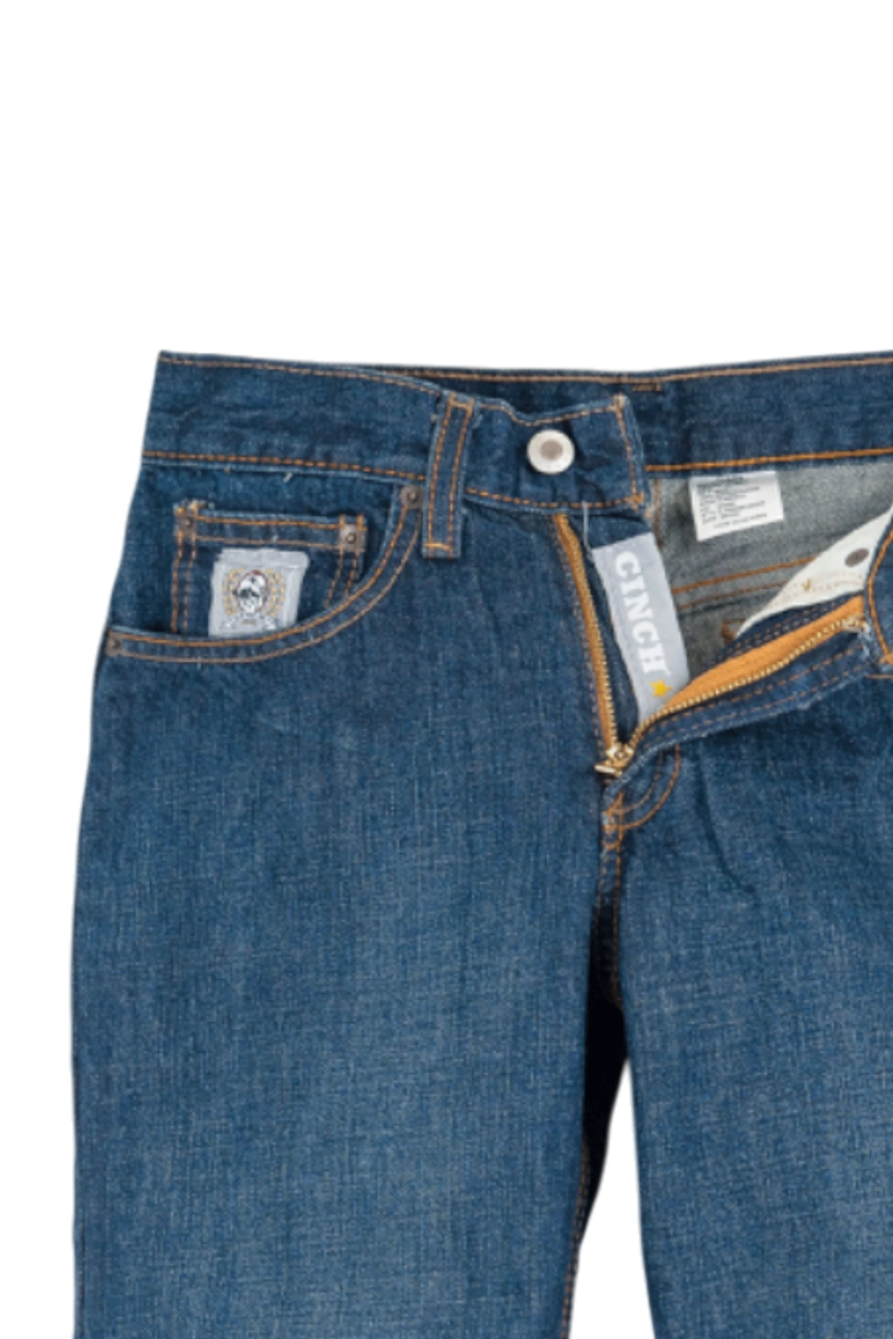 Close-up of blue jeans with brand labels on a white background